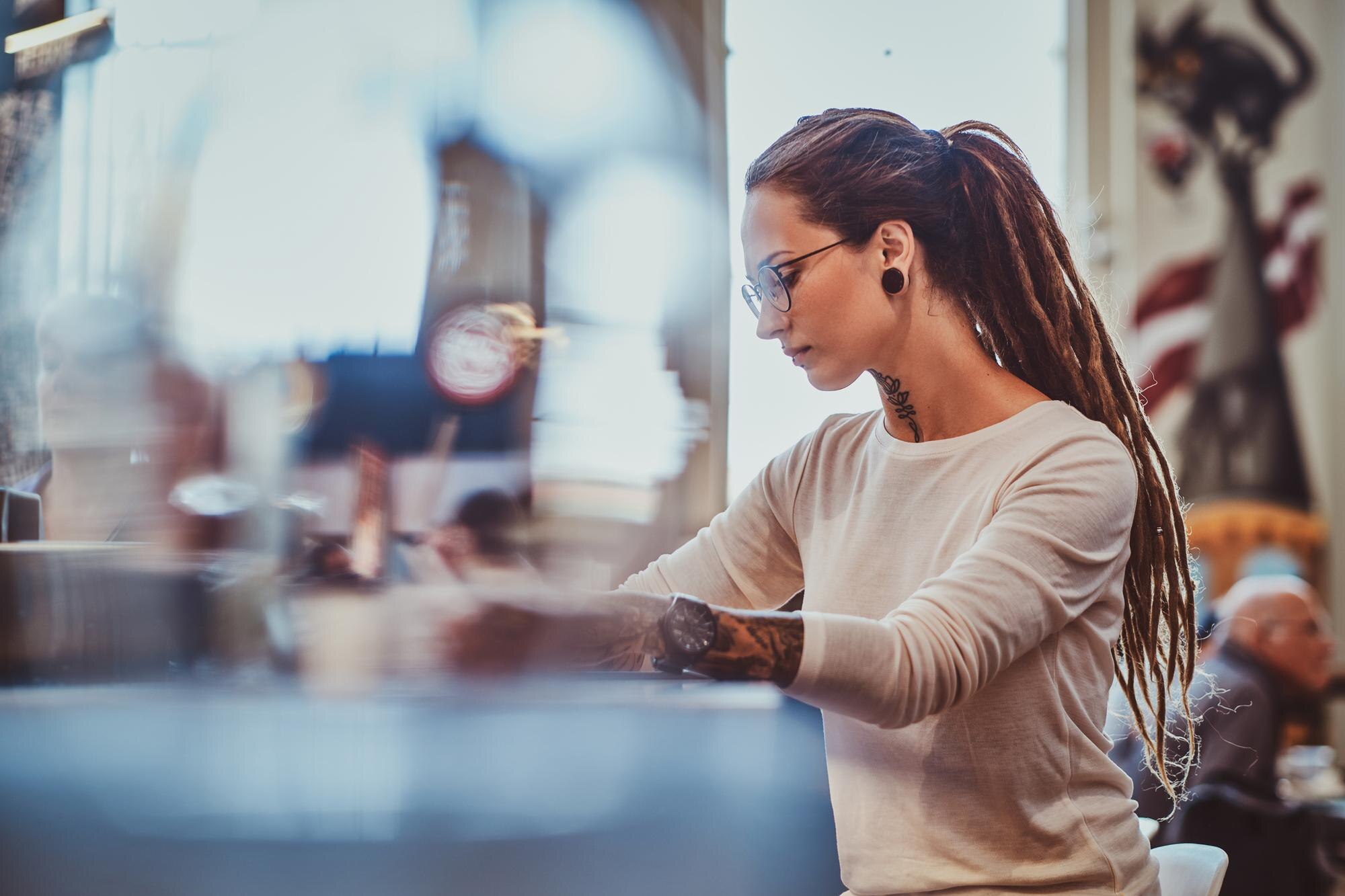 How to Choose the Right Plastic and Fabrication Method for Your Job 2 pretty creative girl in glasses is drawing on digi f1b7990229252d0a0031