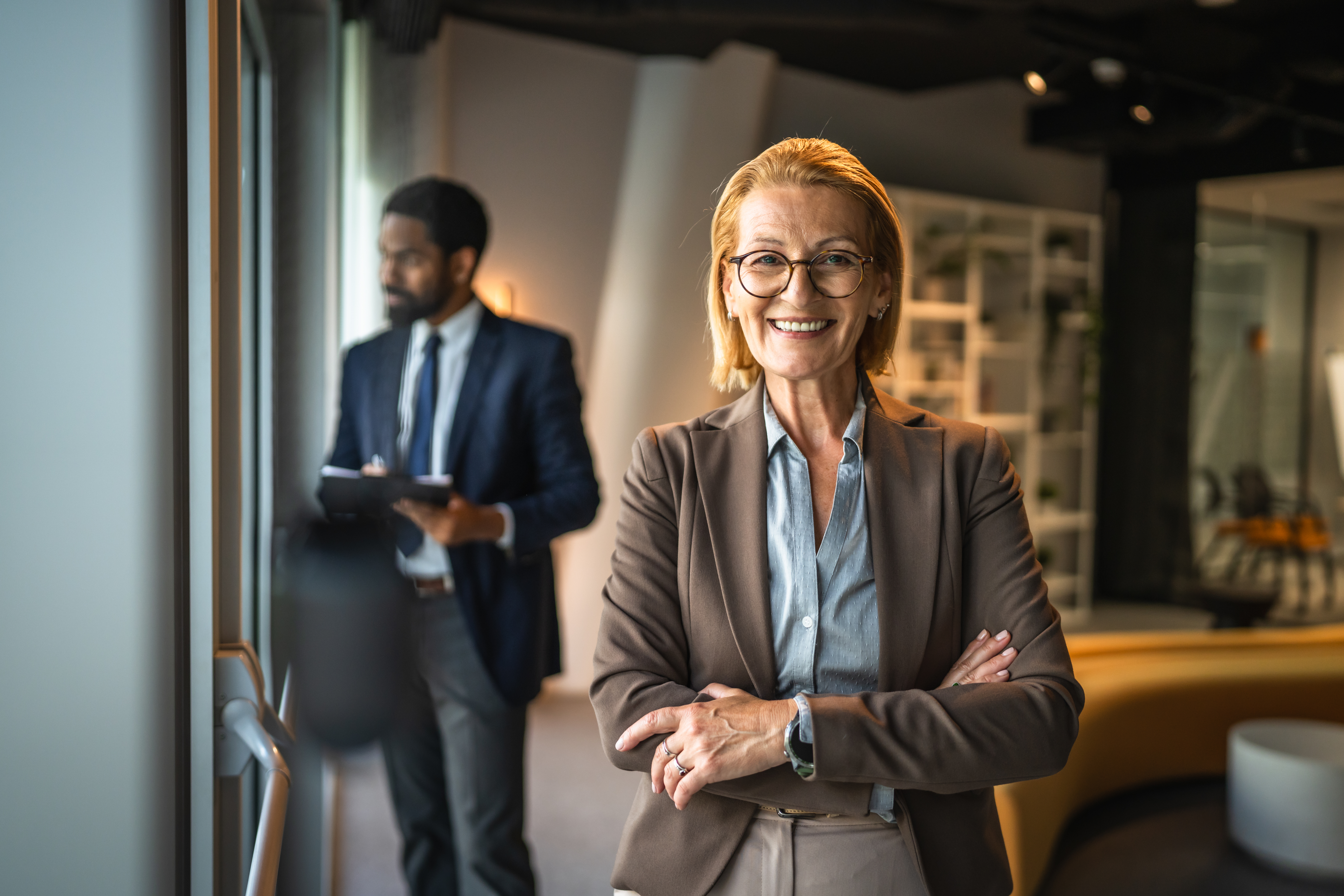 pretty mature businesswoman stand arm crossed and 522825c8580a20b673a6