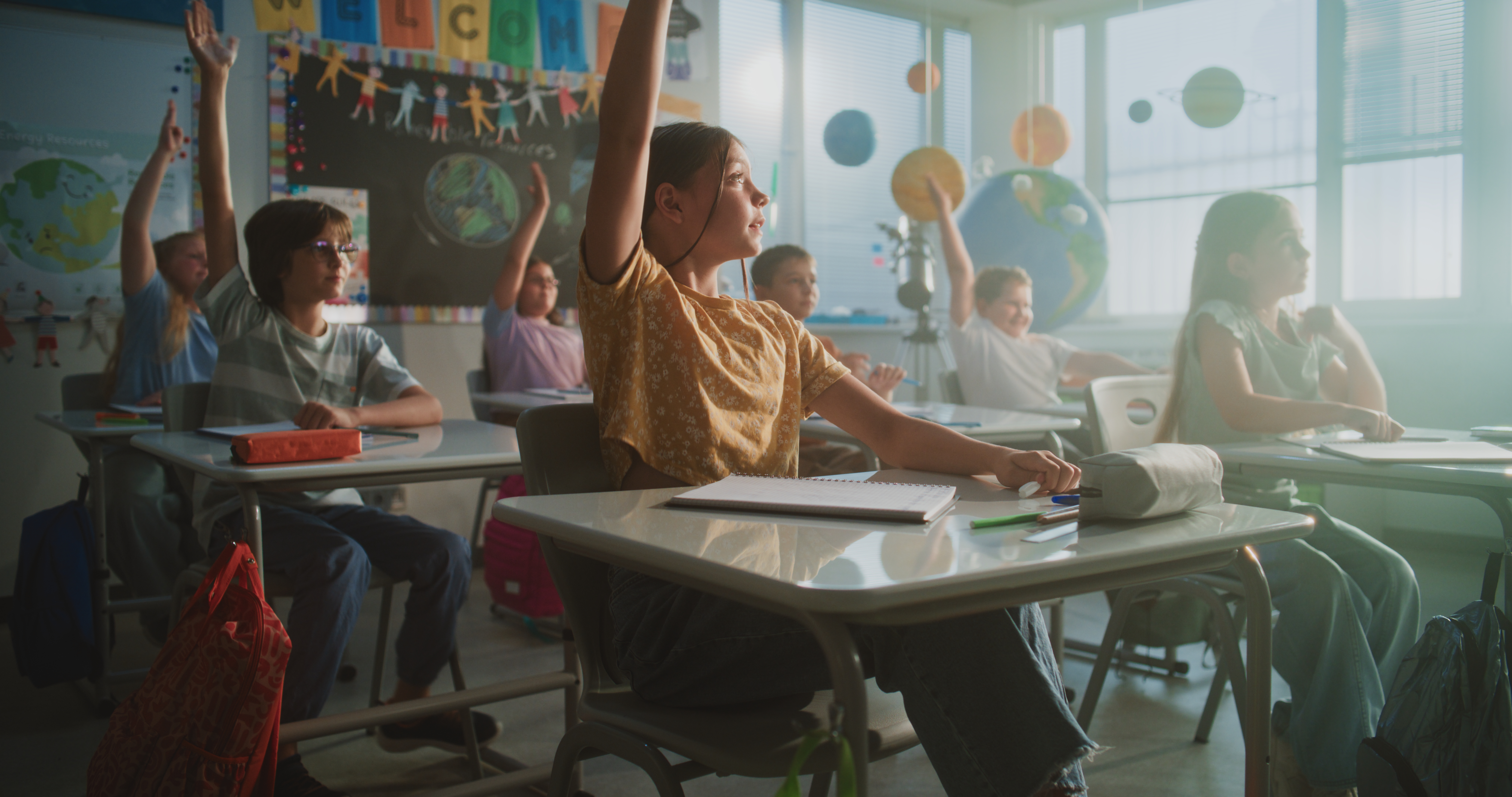 Primary School Children Sitting At The Desks Rais 344b0d1ac6f4edc7b78e