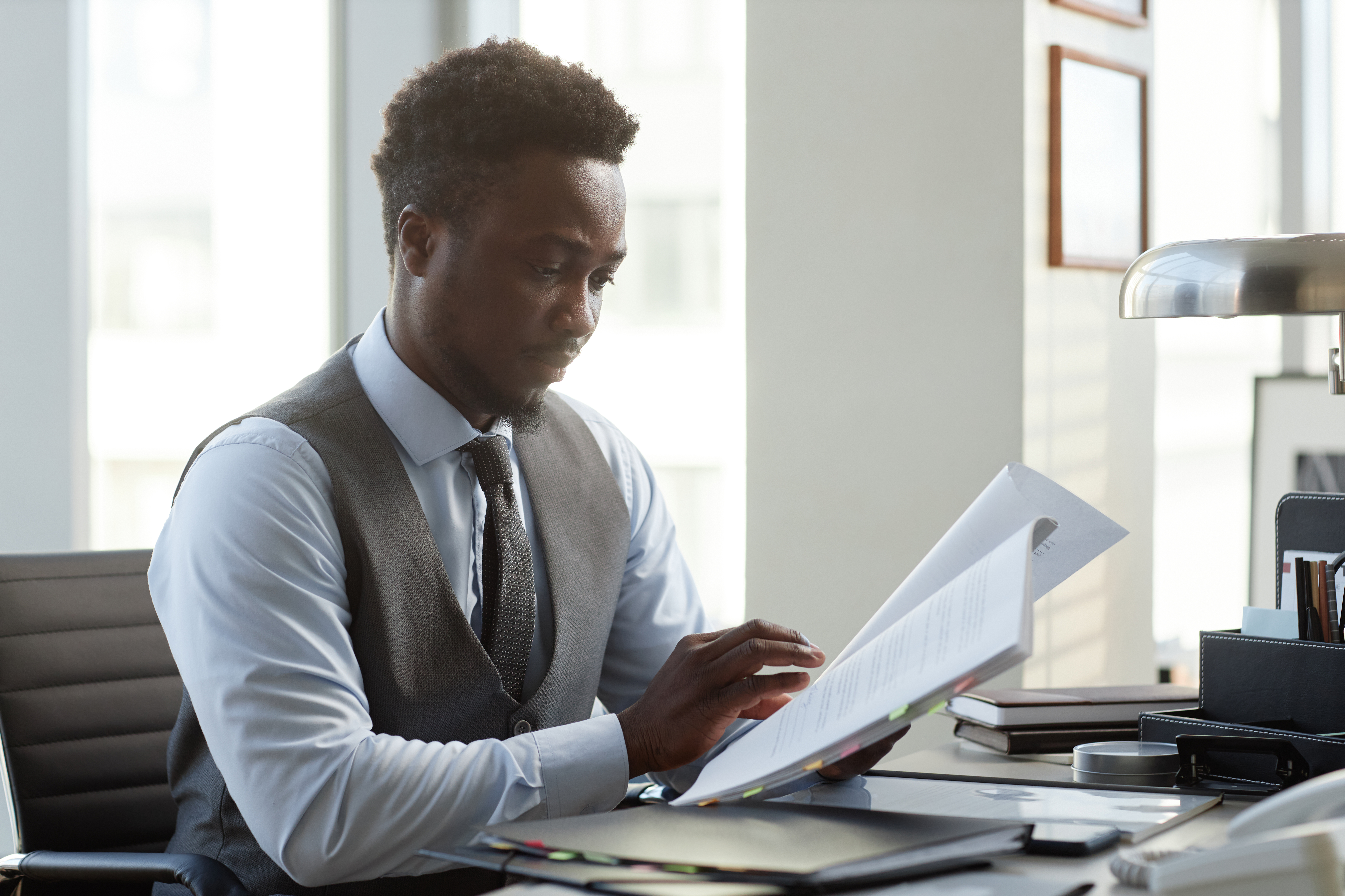 Professional Black Man As Lawyer Reading Document 61D37Ed9Facbef57D896