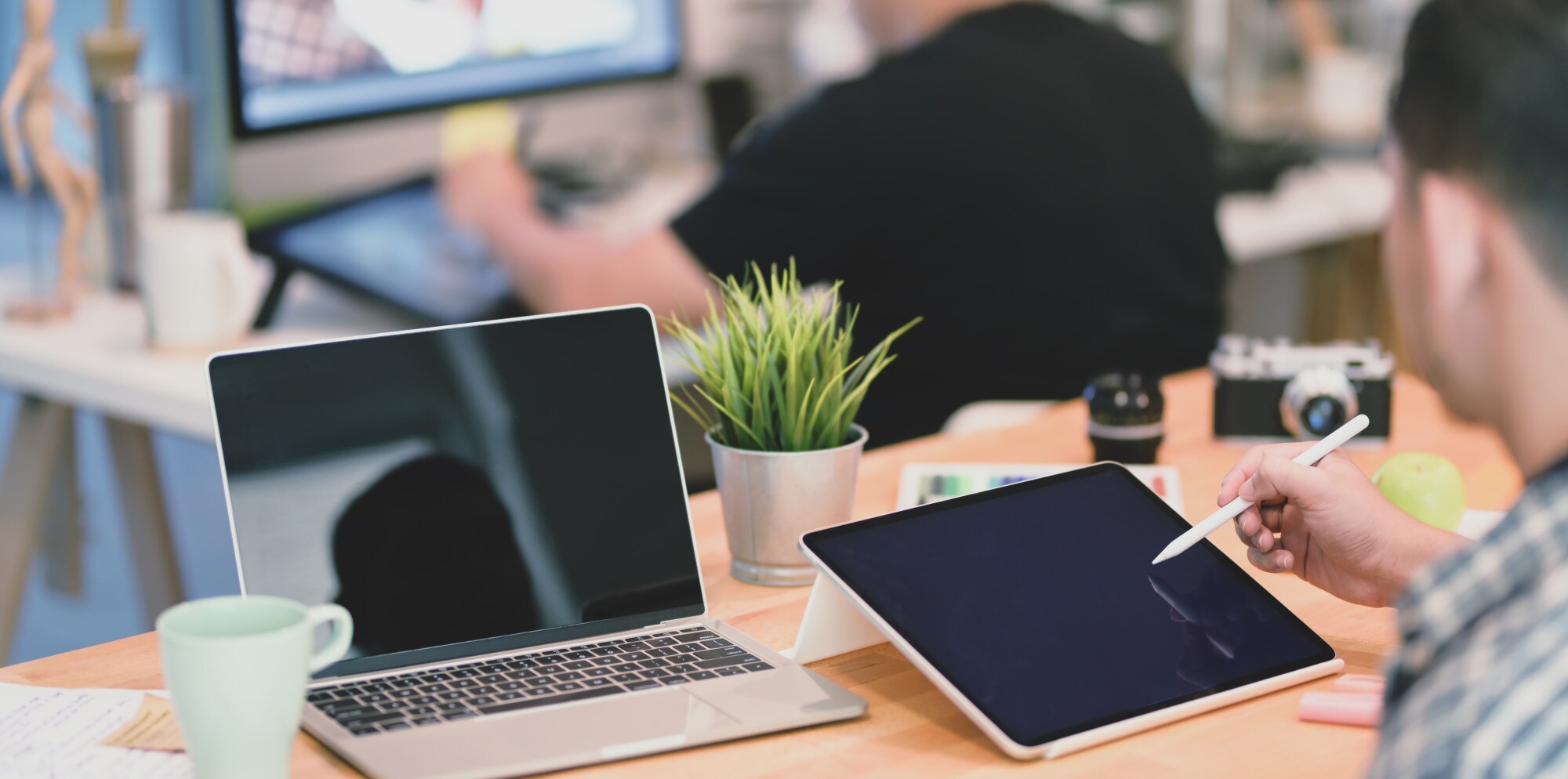 professional designer working with male coworker i 36dc2e0ad228e97ec315