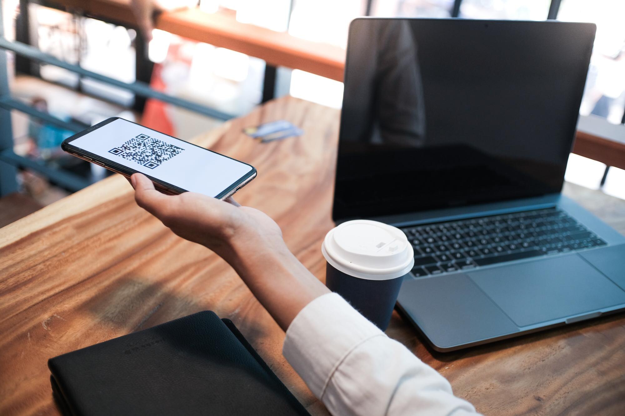 Woman scanning QR code for payment