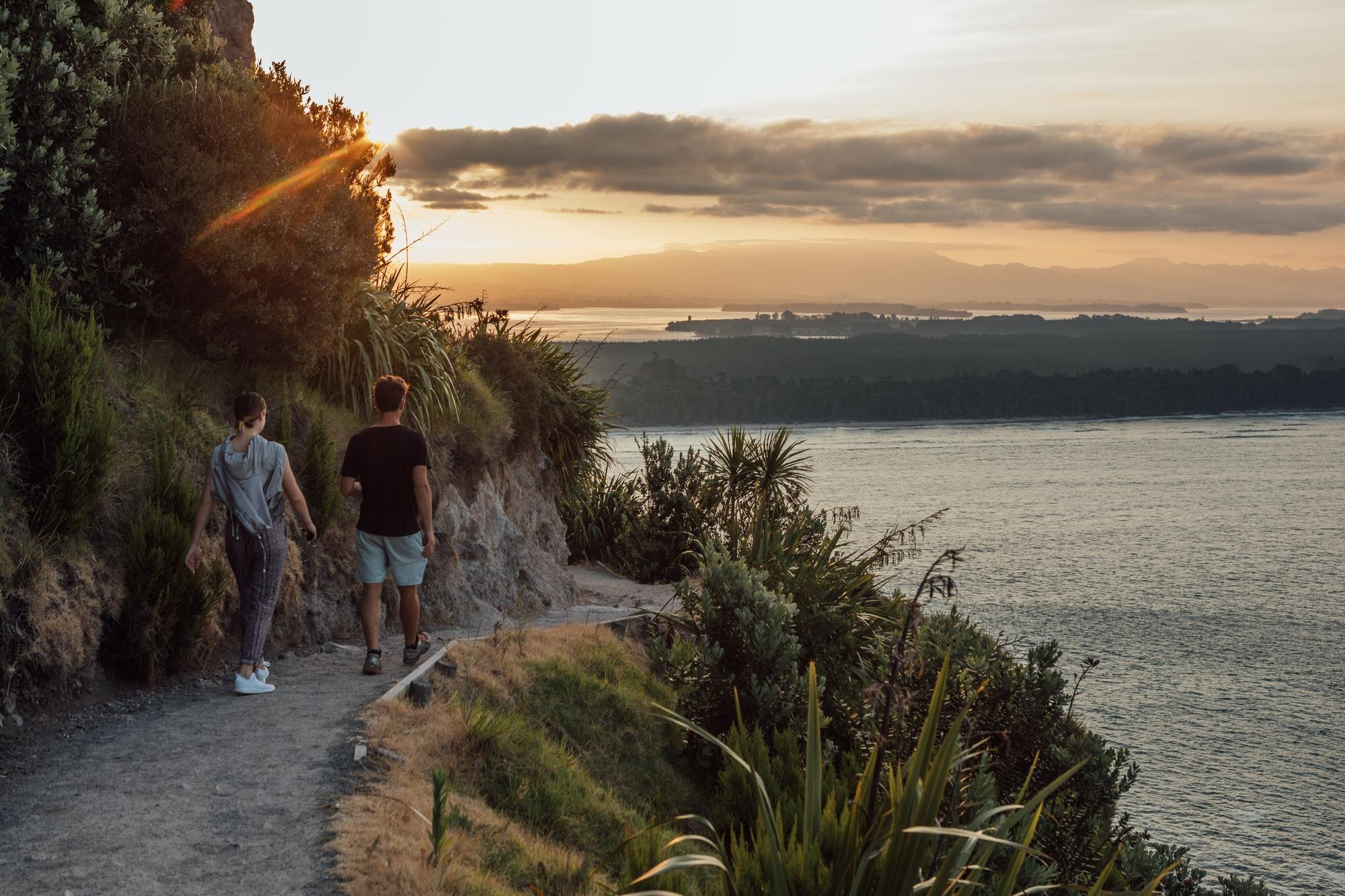 rear view of friends walking on road by river agai 86587045145723befd2c BTOURS