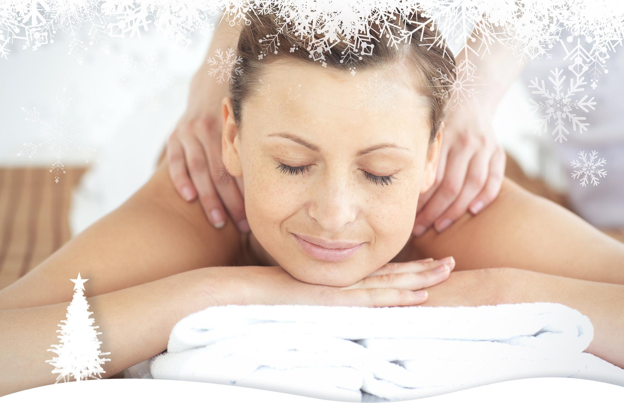 relaxed woman enjoying a back massage against fir 9cfda282cbcceb5040b2