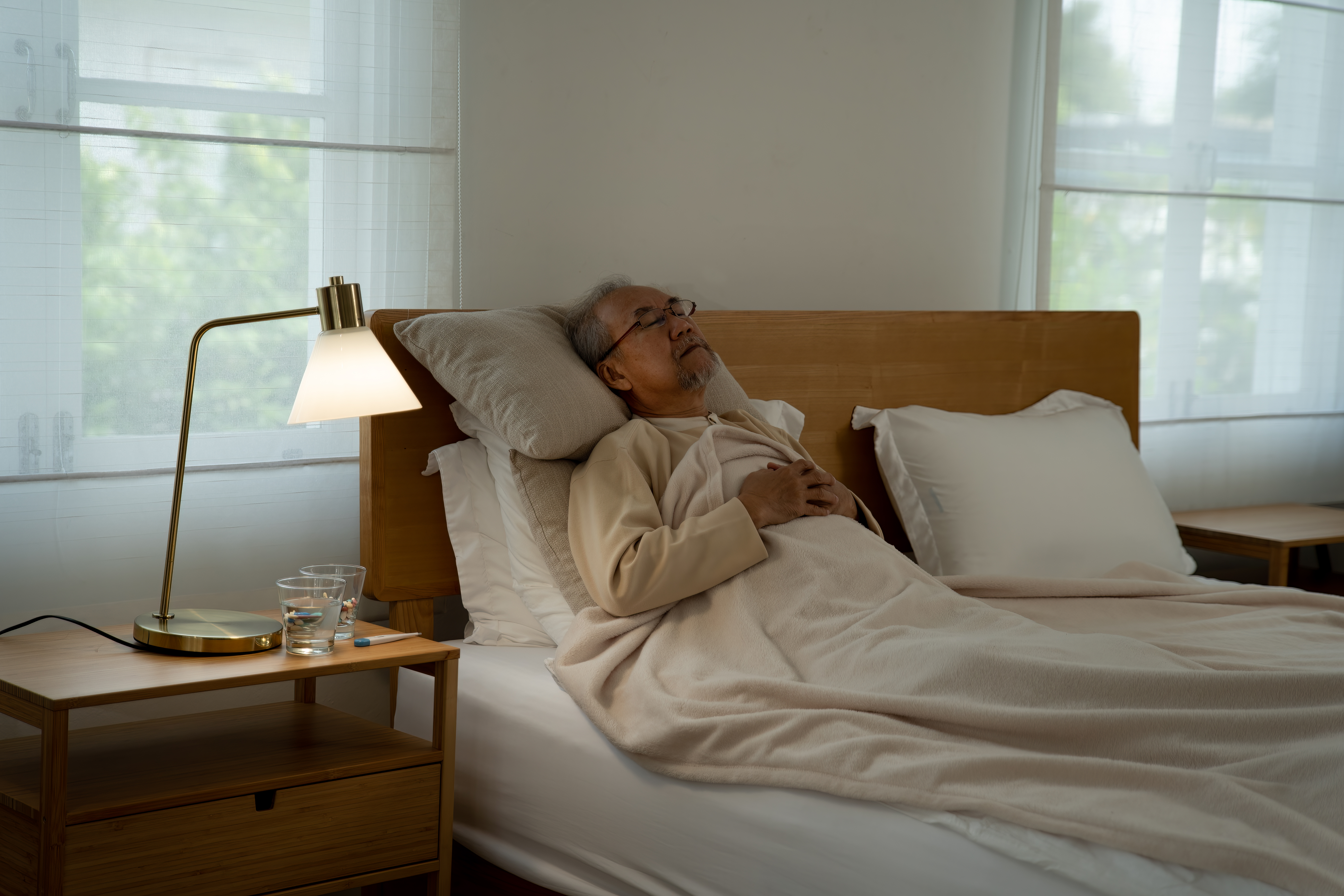 retirement eldely man sick lonely laid on bed 3f8d7beb2c21ab805992