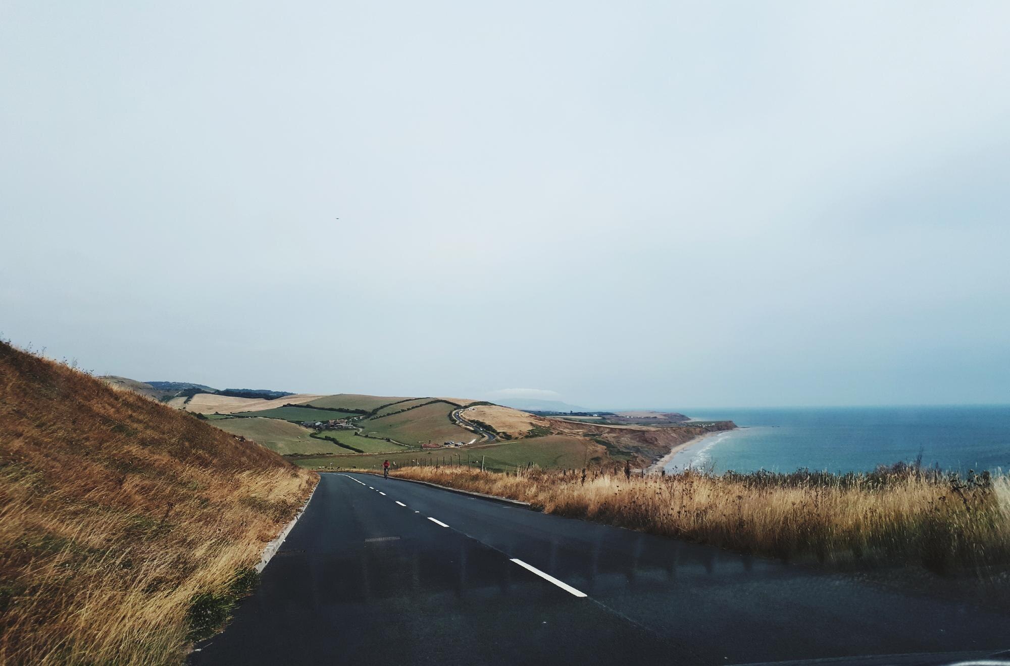road by sea against sky 931b975a775b8e91f4ae BTOURS