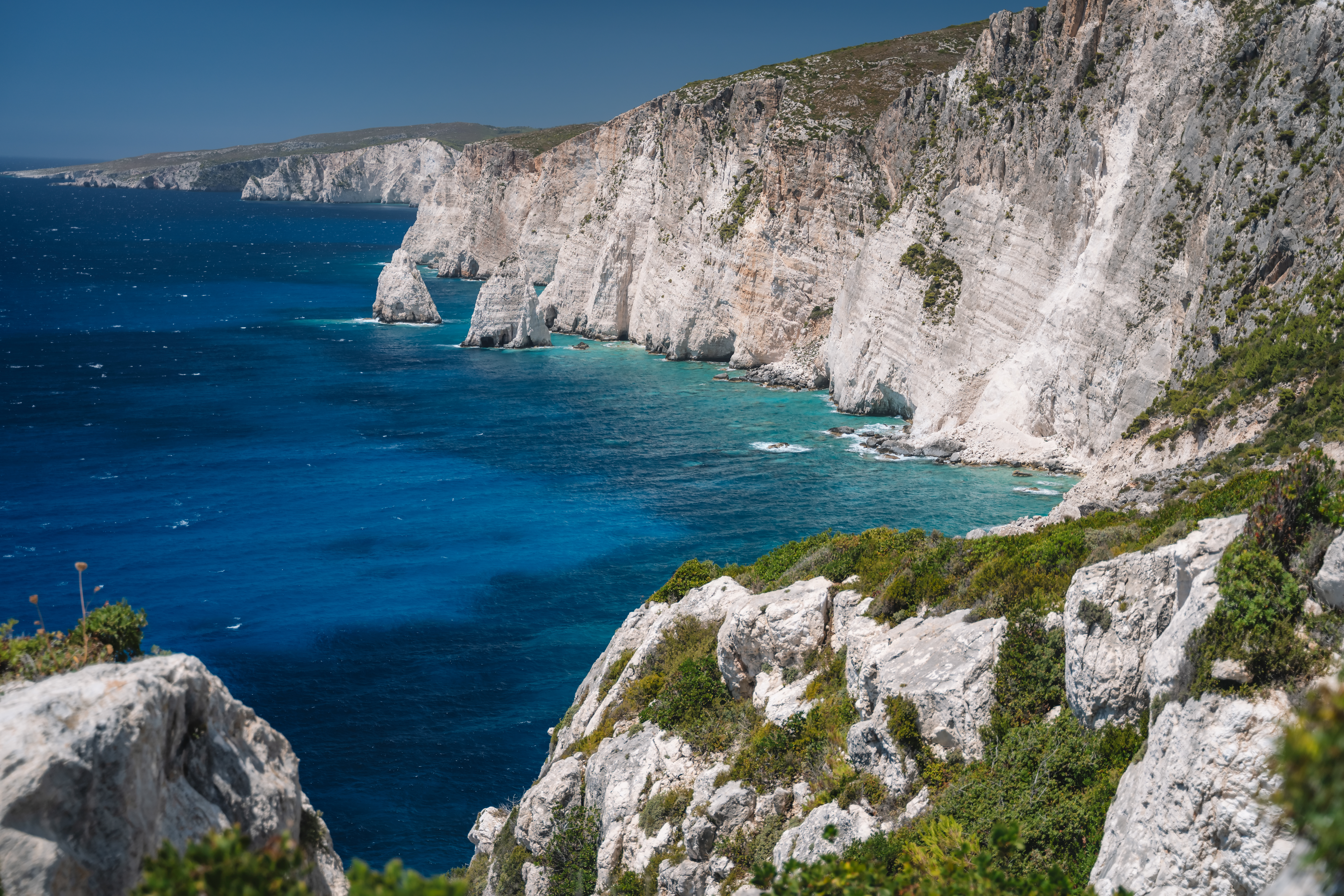 Island Hopping in Greece: Crafting Unforgettable Adventures with BTOURS 3 rocky coastline of zakynthos island near plakaki b 0f55e1e8fee7c4e13f14 BTOURS