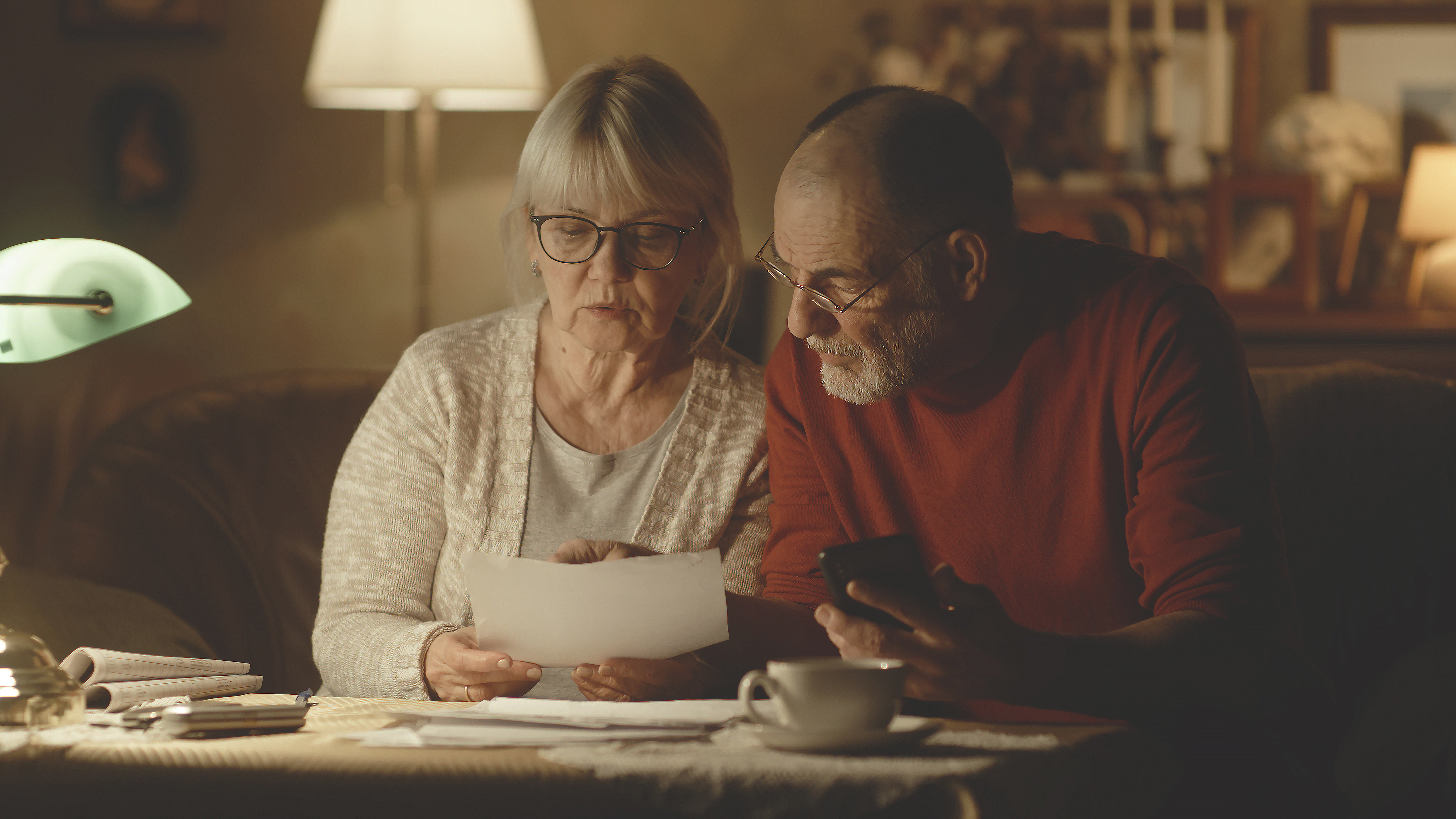 senior couple calculating utility payments togethe 3a1dcea258047e596b5c