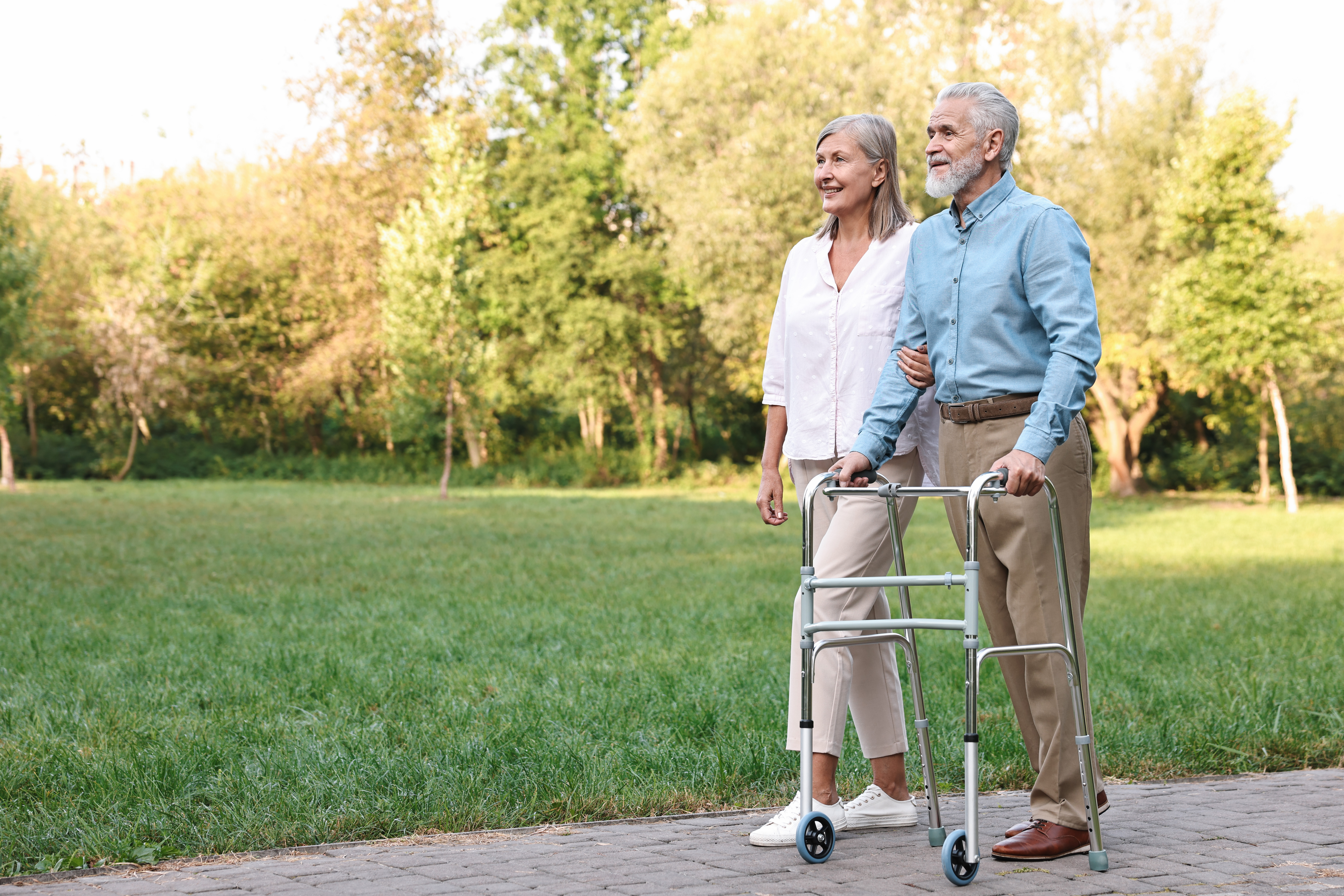 senior couple with walking frame in park space fo 274fe3768c581eacff38