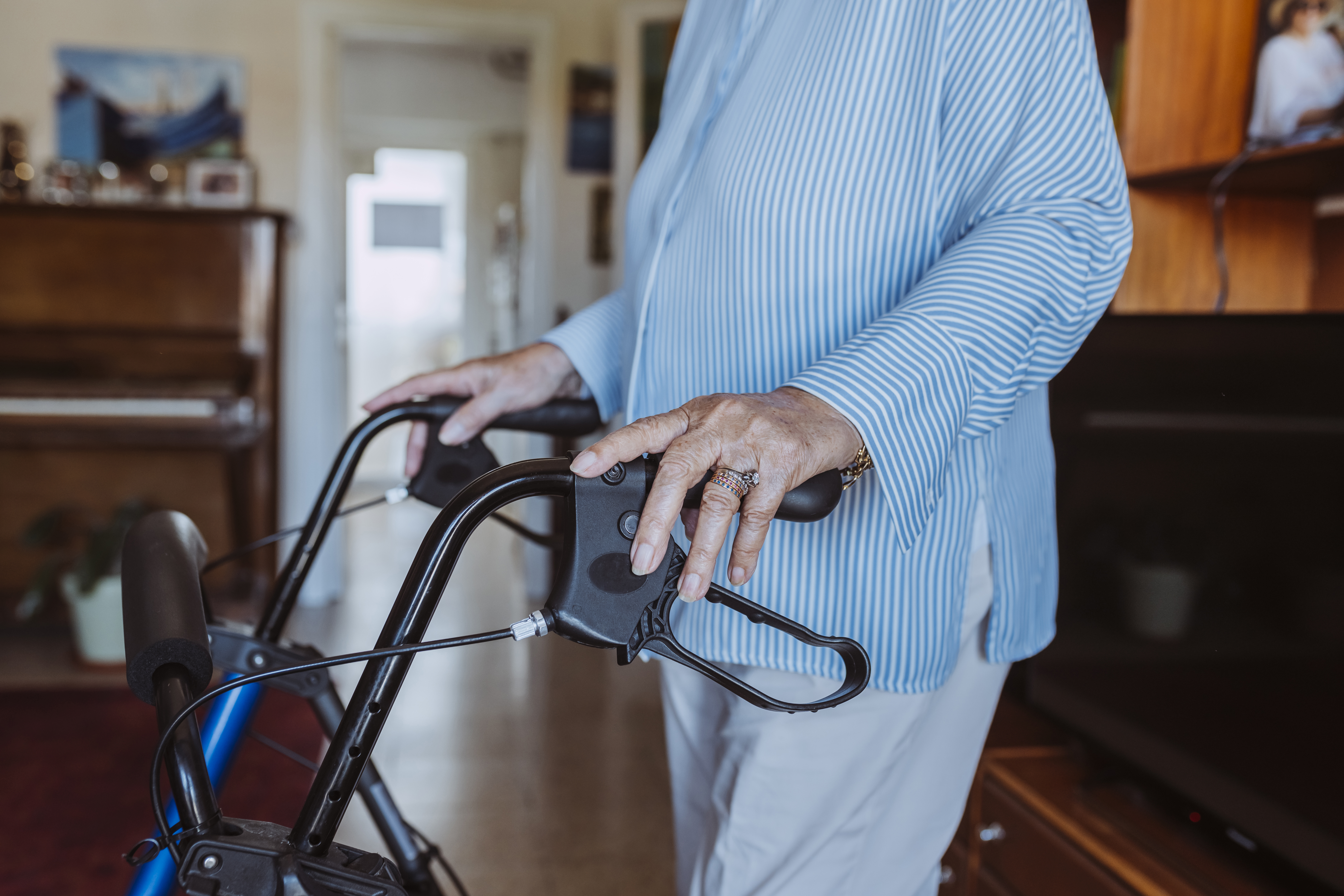 senior grandmother using walker indoors 9d2cfcbacb5c12edc3ea