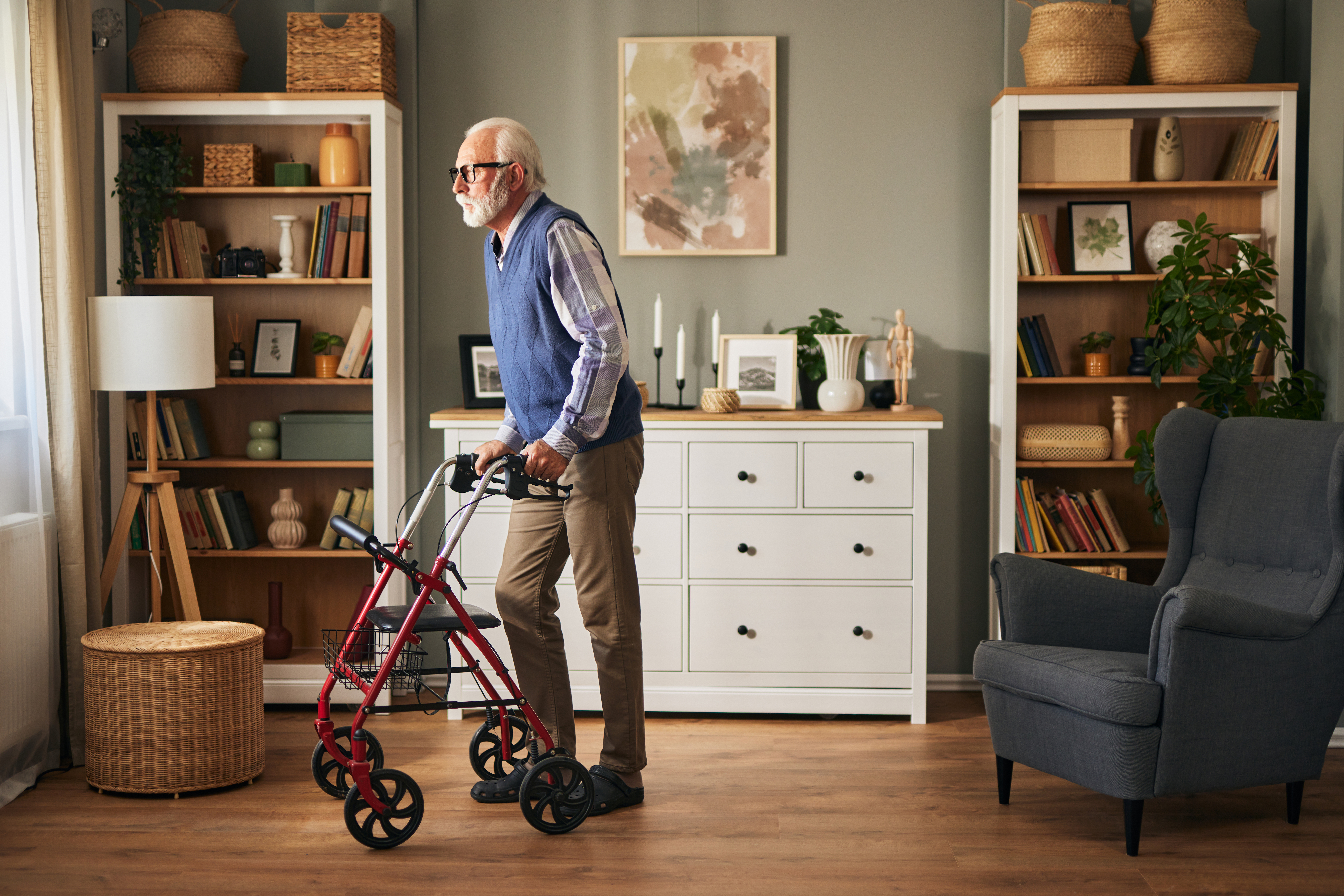 senior man with disability using walker assistance f61ab8cc608a9f82e3ca