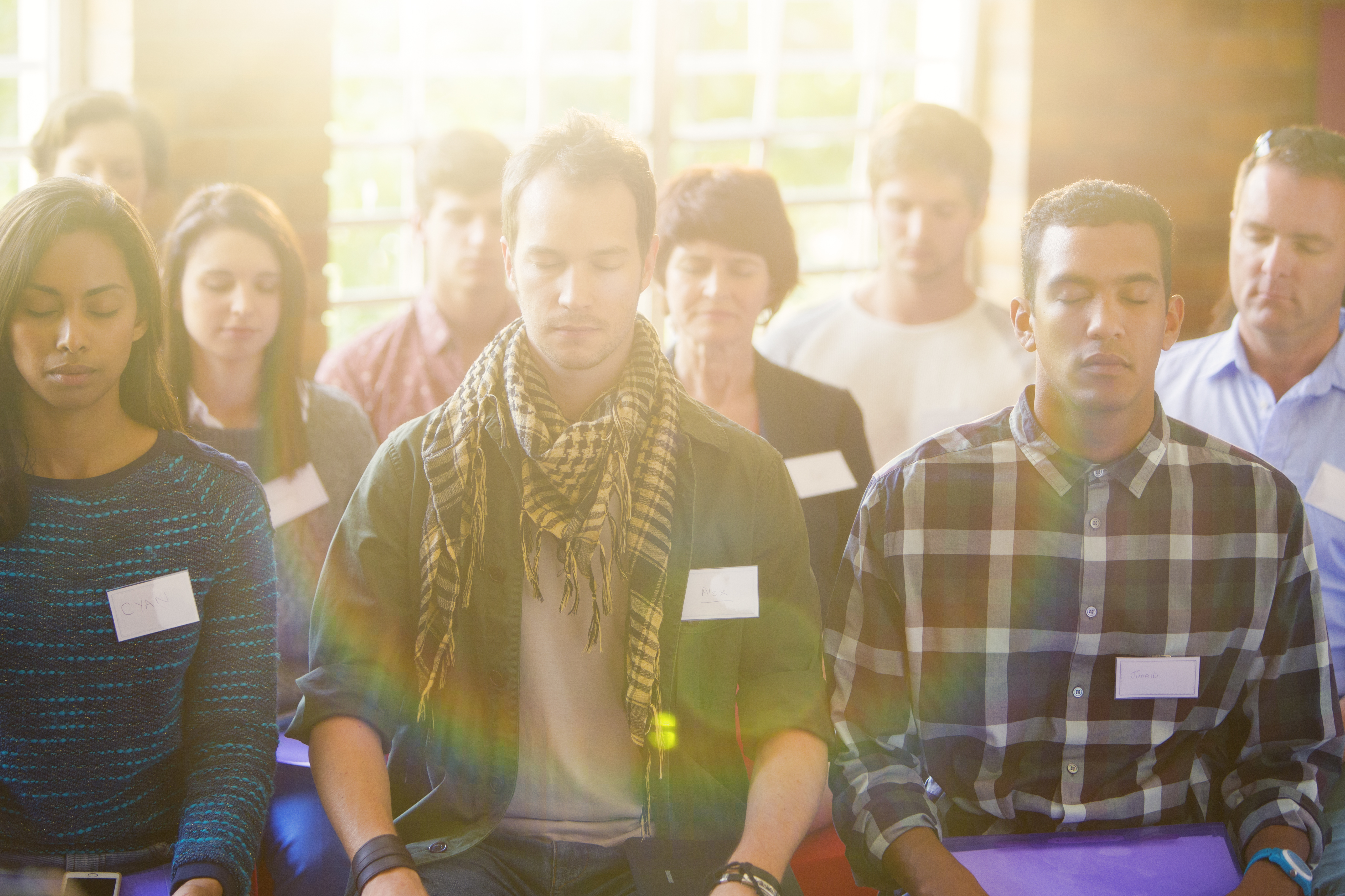serene people with eyes closed in audience 0cb557631c98c1f66919