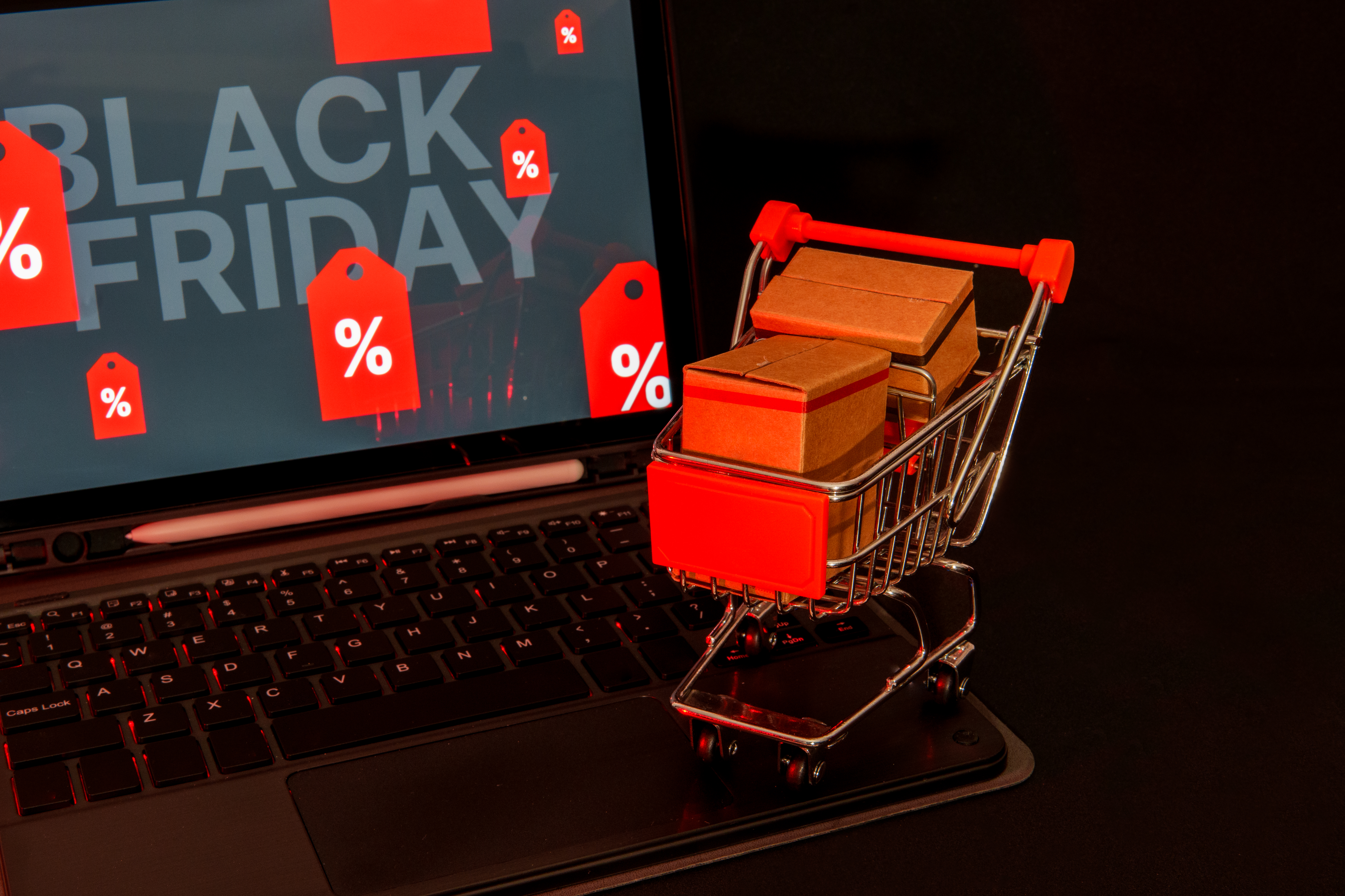 Shopping Cart Full Of Boxes On Laptop Keyboard Wit 57bcc2805b7fe3b5b485
