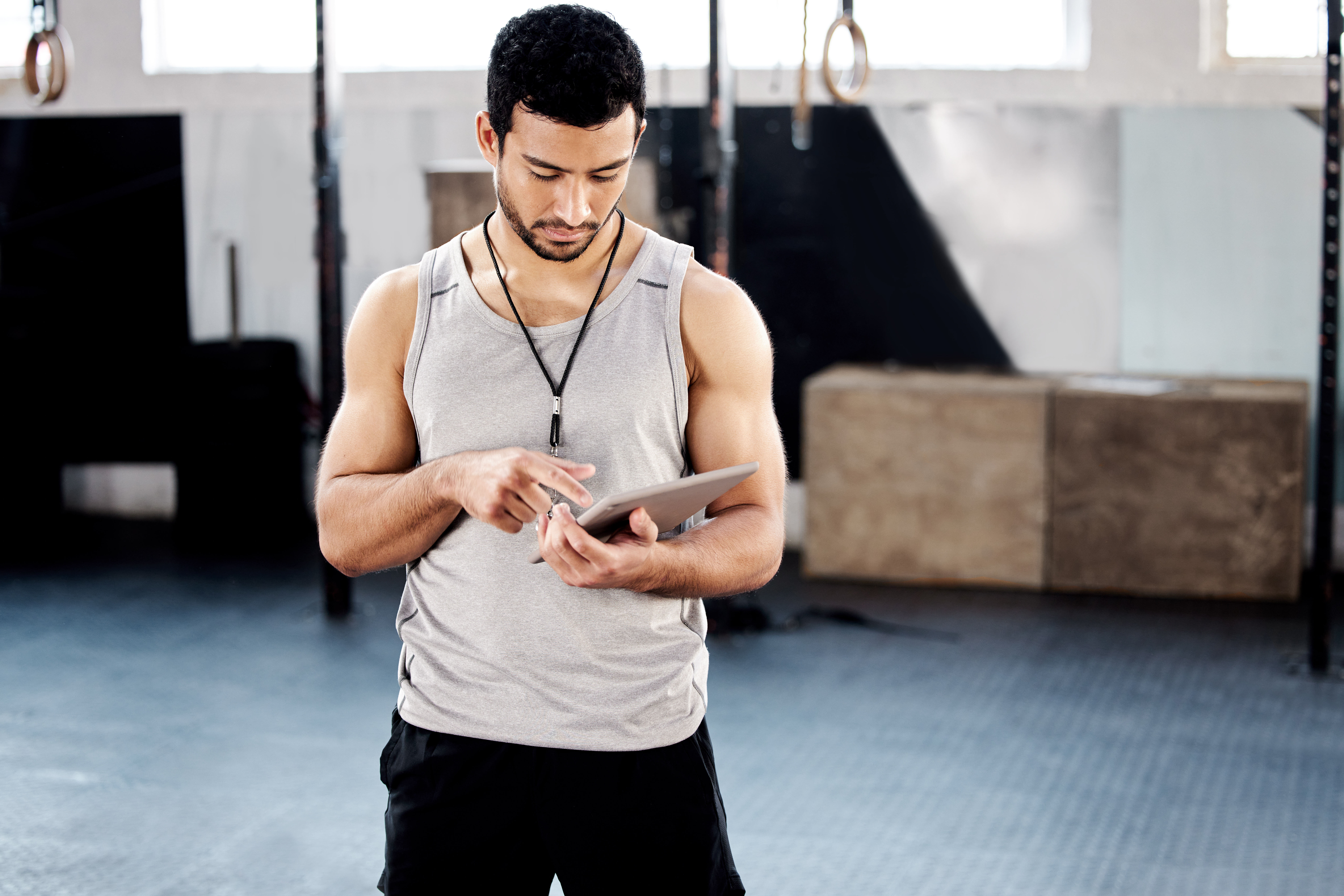 Shot Of A Handsome Young Man Using A Digital Table A61f769a795a28615368