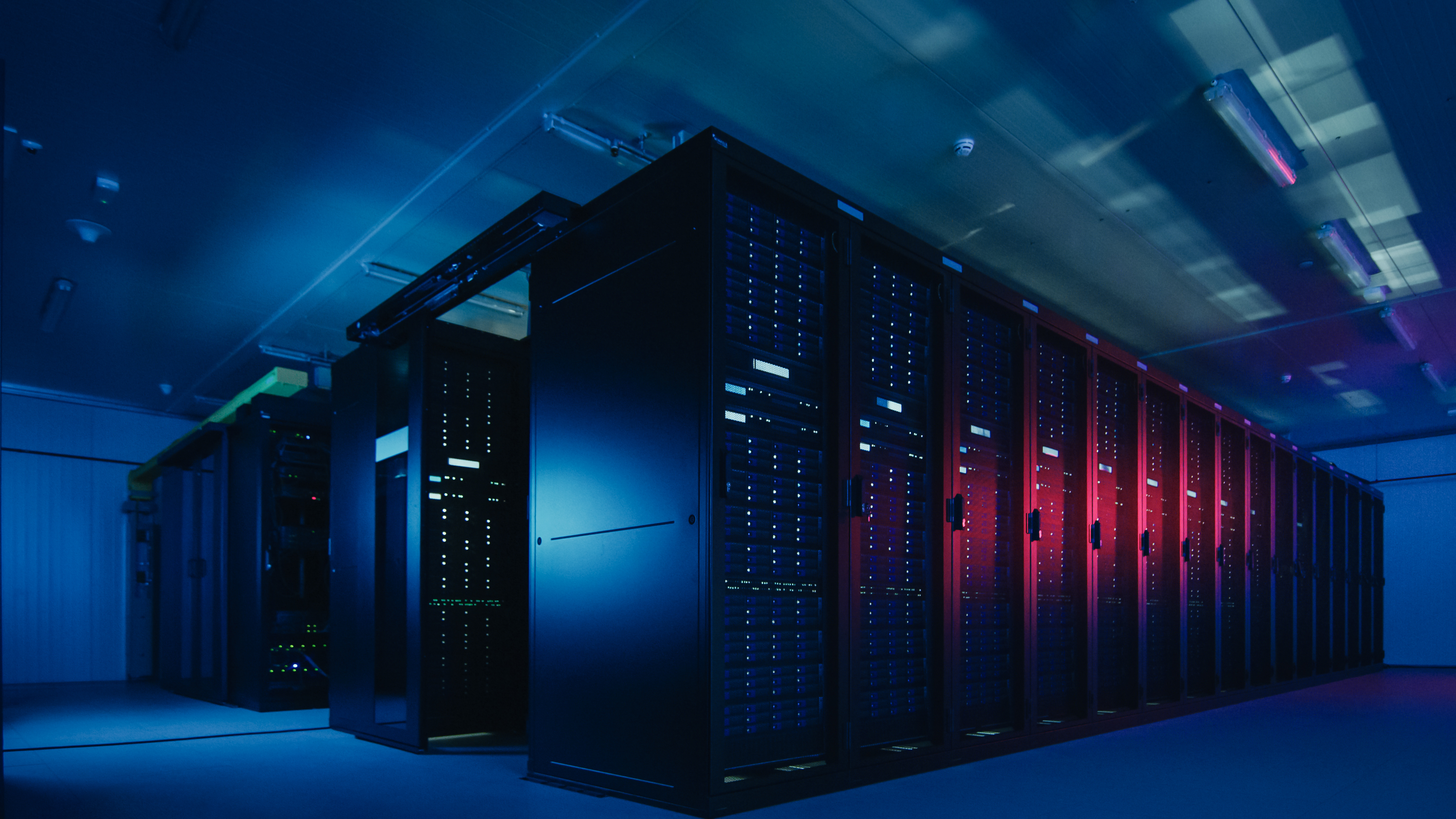 Shot Of Data Center With Multiple Rows Of Fully Op 0A92A6533Ae35D8F245D Scalable Hosting