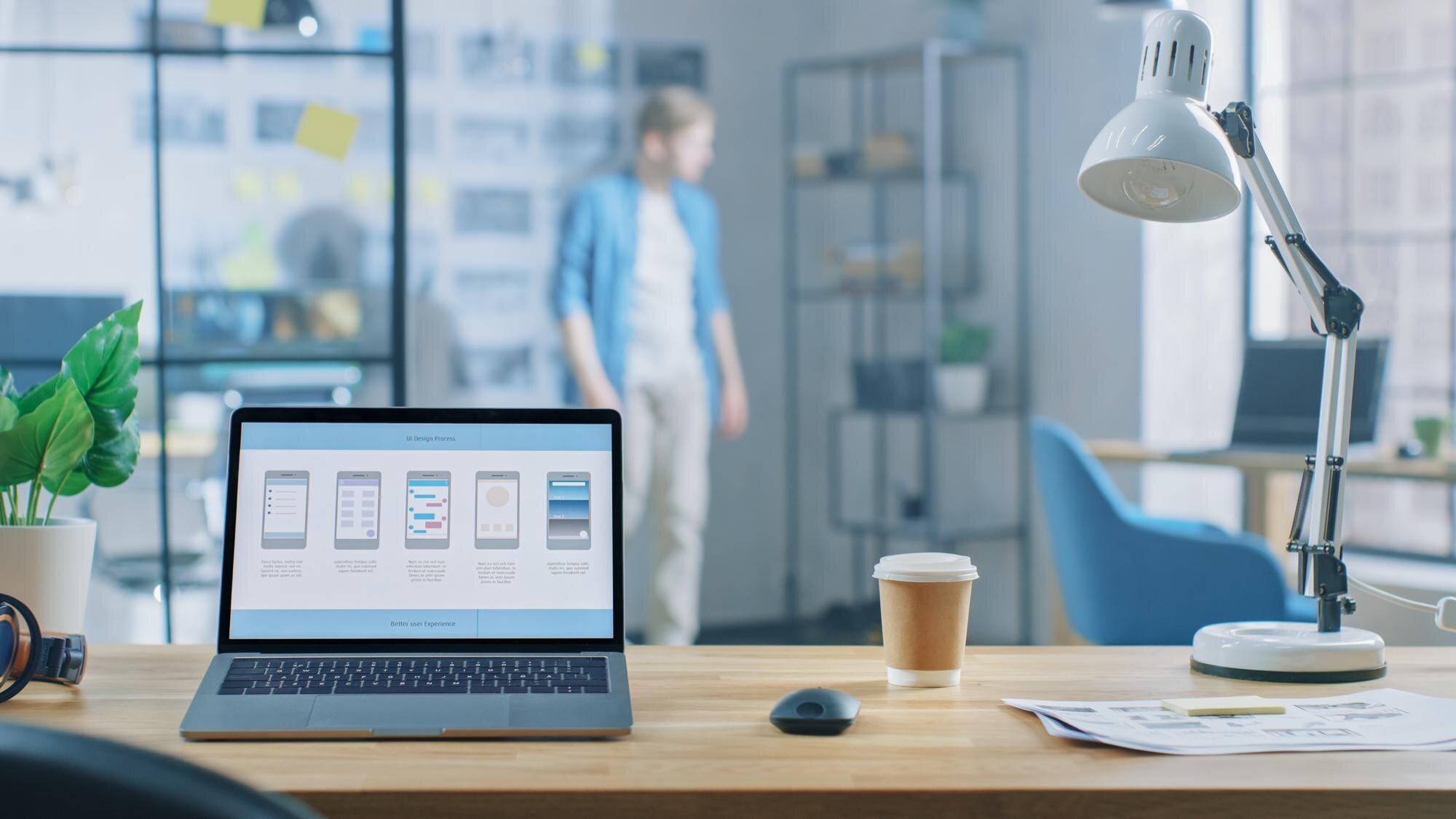 shot of laptop standing at desk in the creative of d706c7a3eb2932c2c2c3