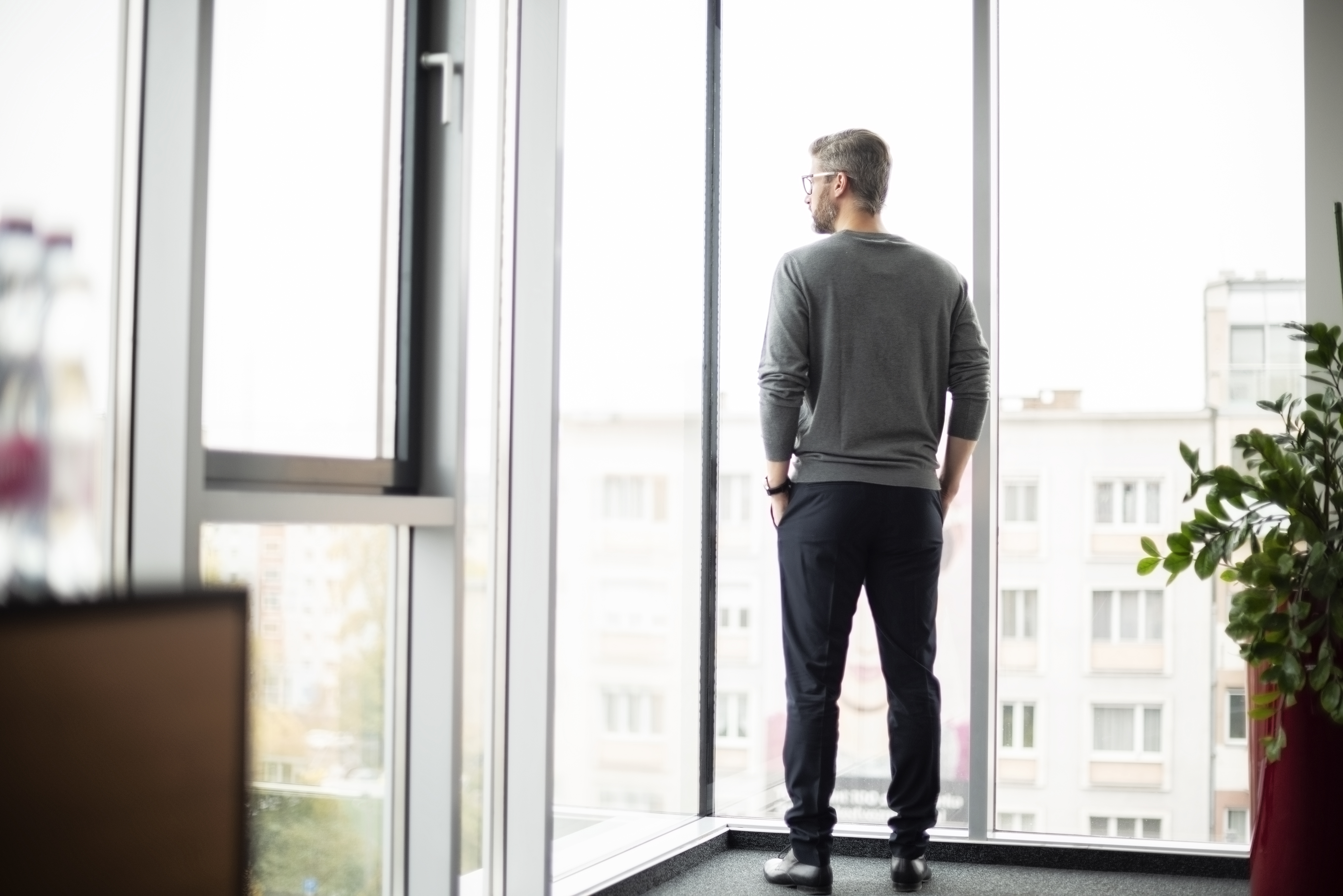 shot of thinking businesman standing at the office a811017bd2699aa1a0ce