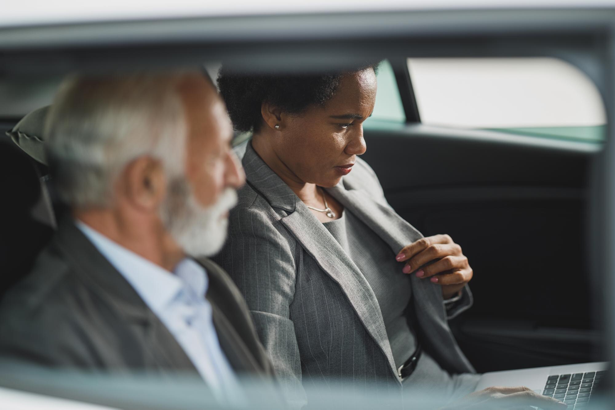 Professional chauffeur providing executive transportation in a luxury vehicle