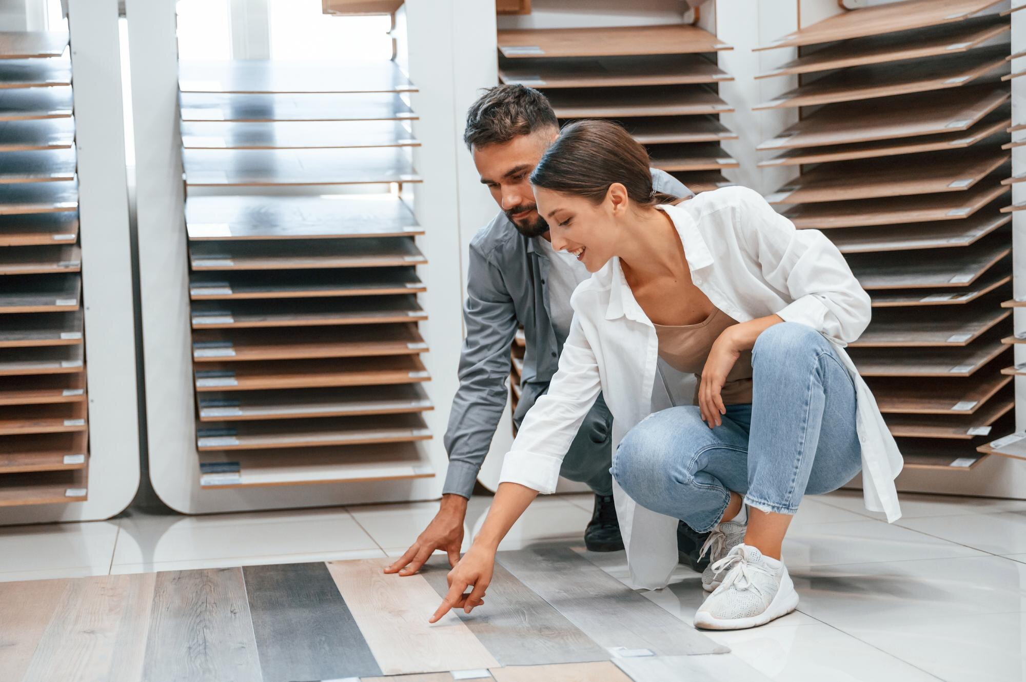 Sitting and choosing parquet woman and man is in t d5f19f8991ea5dd5a2af
