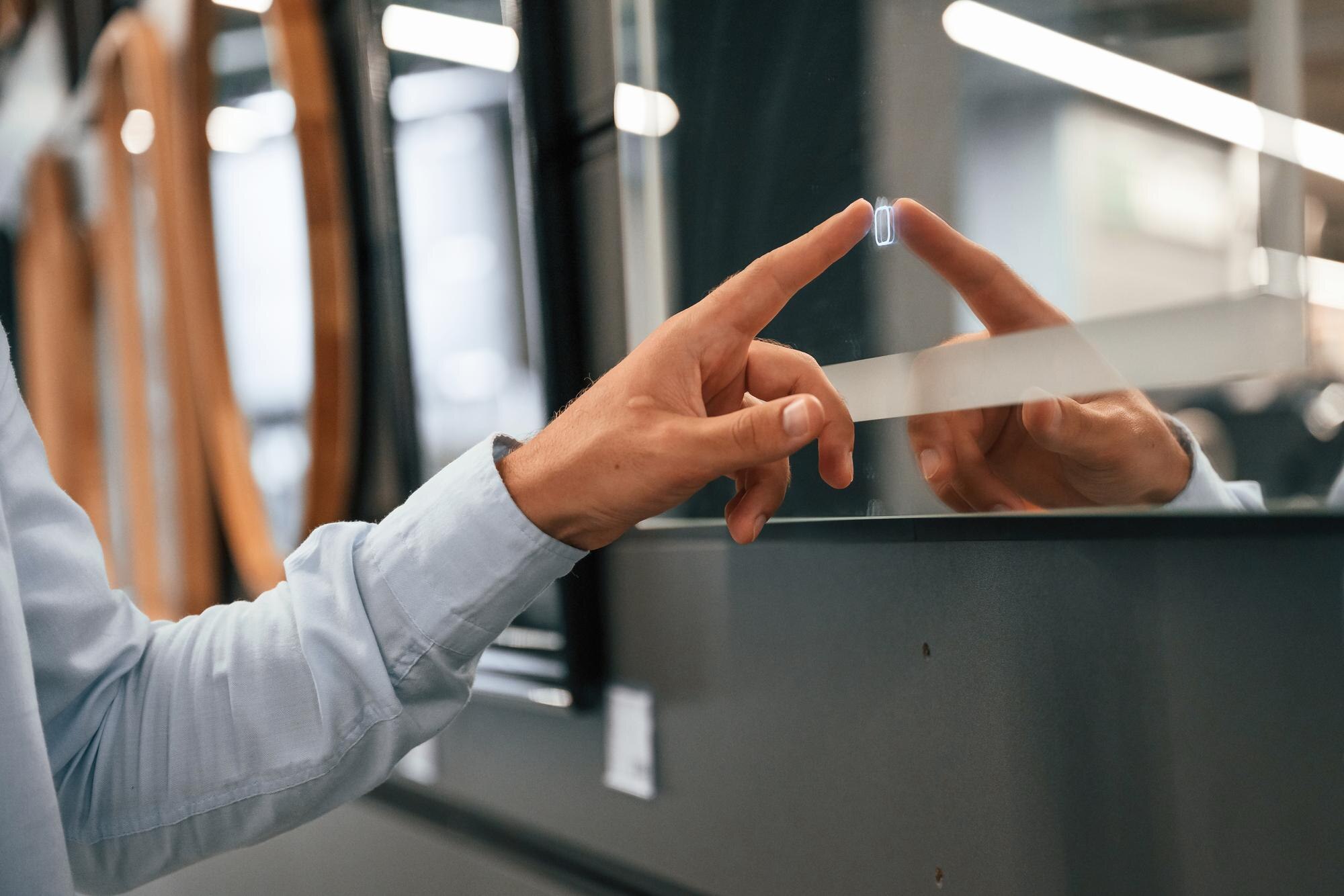 Award‑Winning Plastic Cutting and Thermoforming, Explained 2 smart mirror touching it man is in the hardware sh f0769b9552bff0b1ddc2