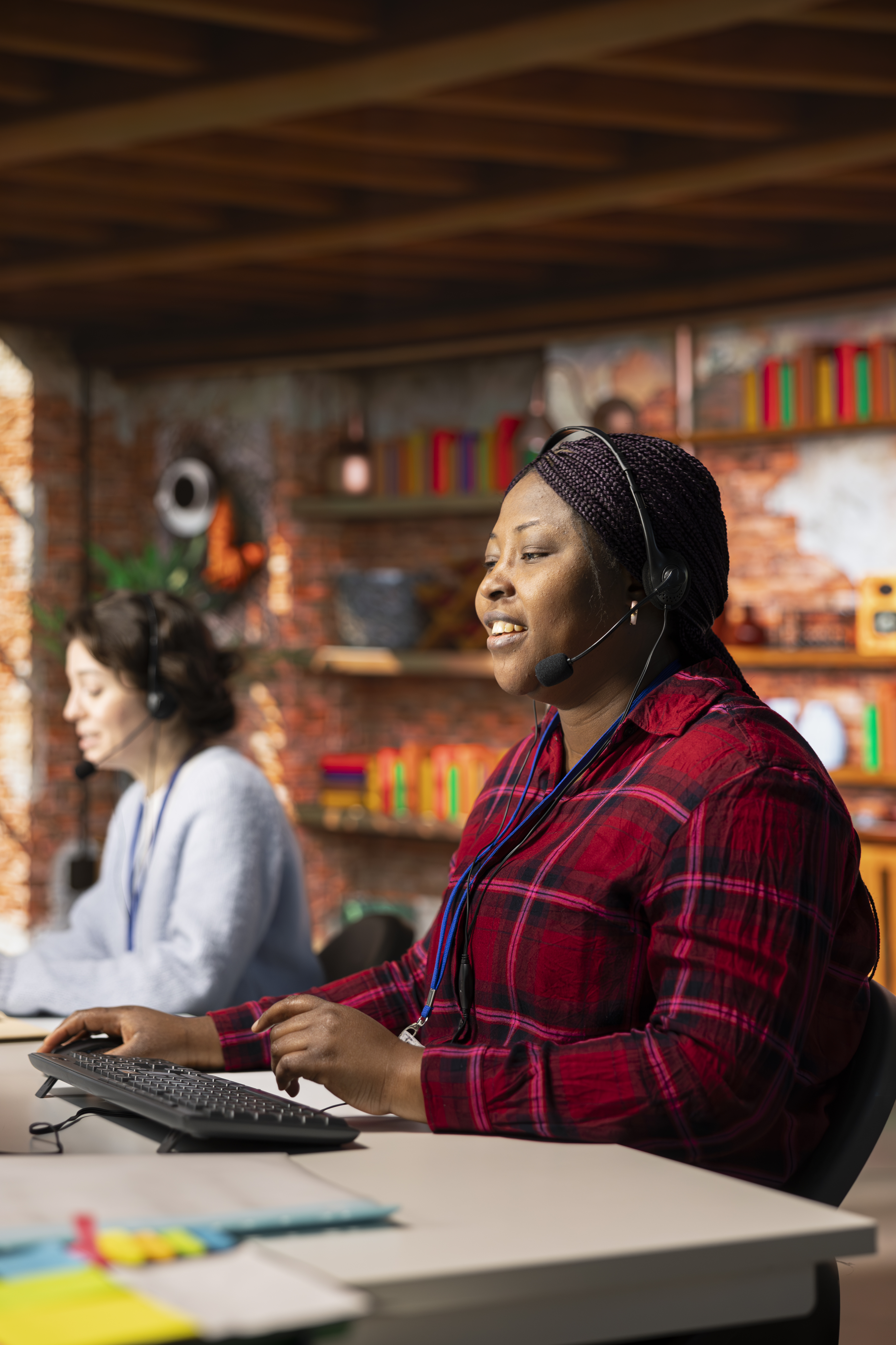 smiling call center staff member analyzes customer 2b514ac28f1471781a93