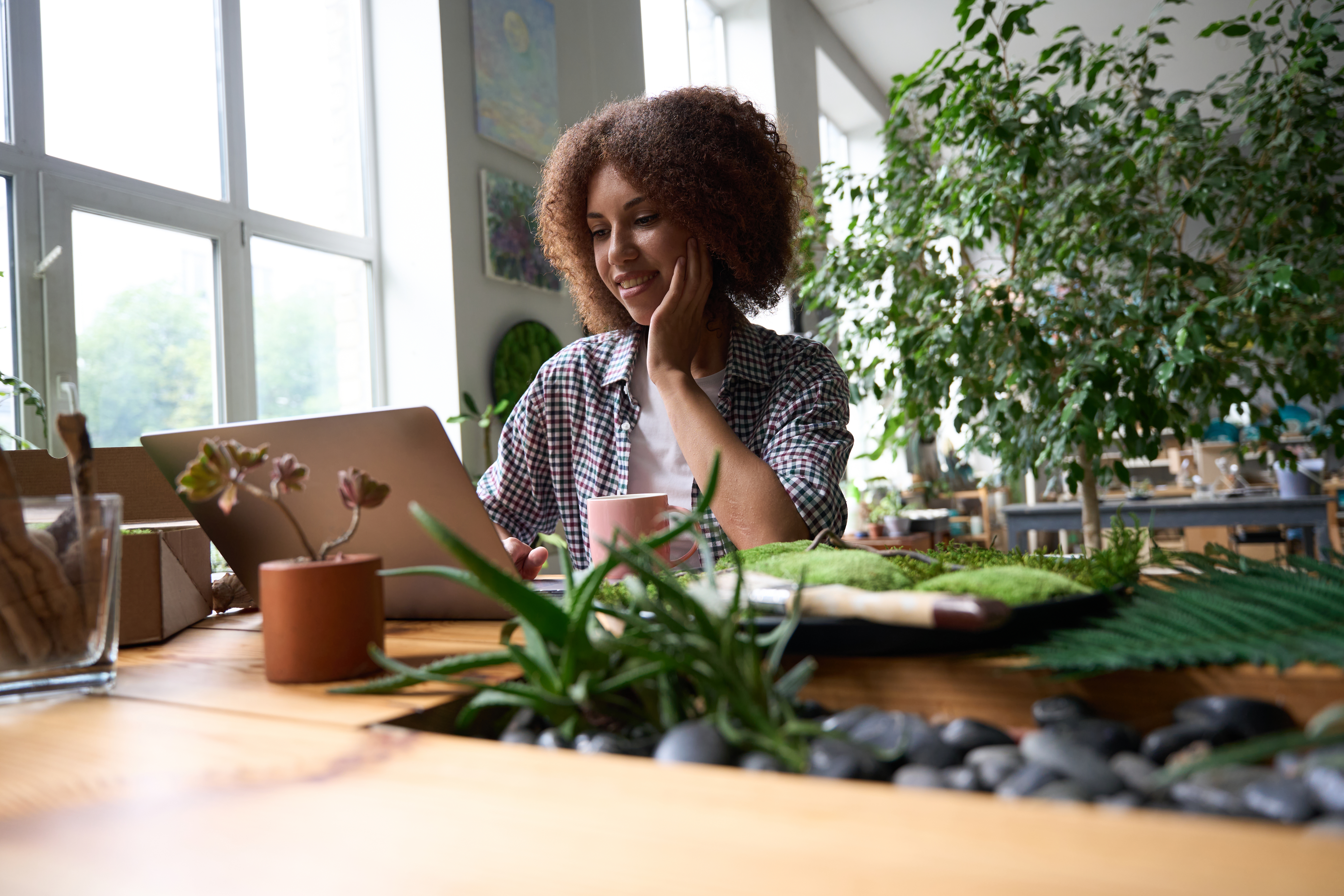 smiling female with laptop running flower shop c9469123d31b0224eeab