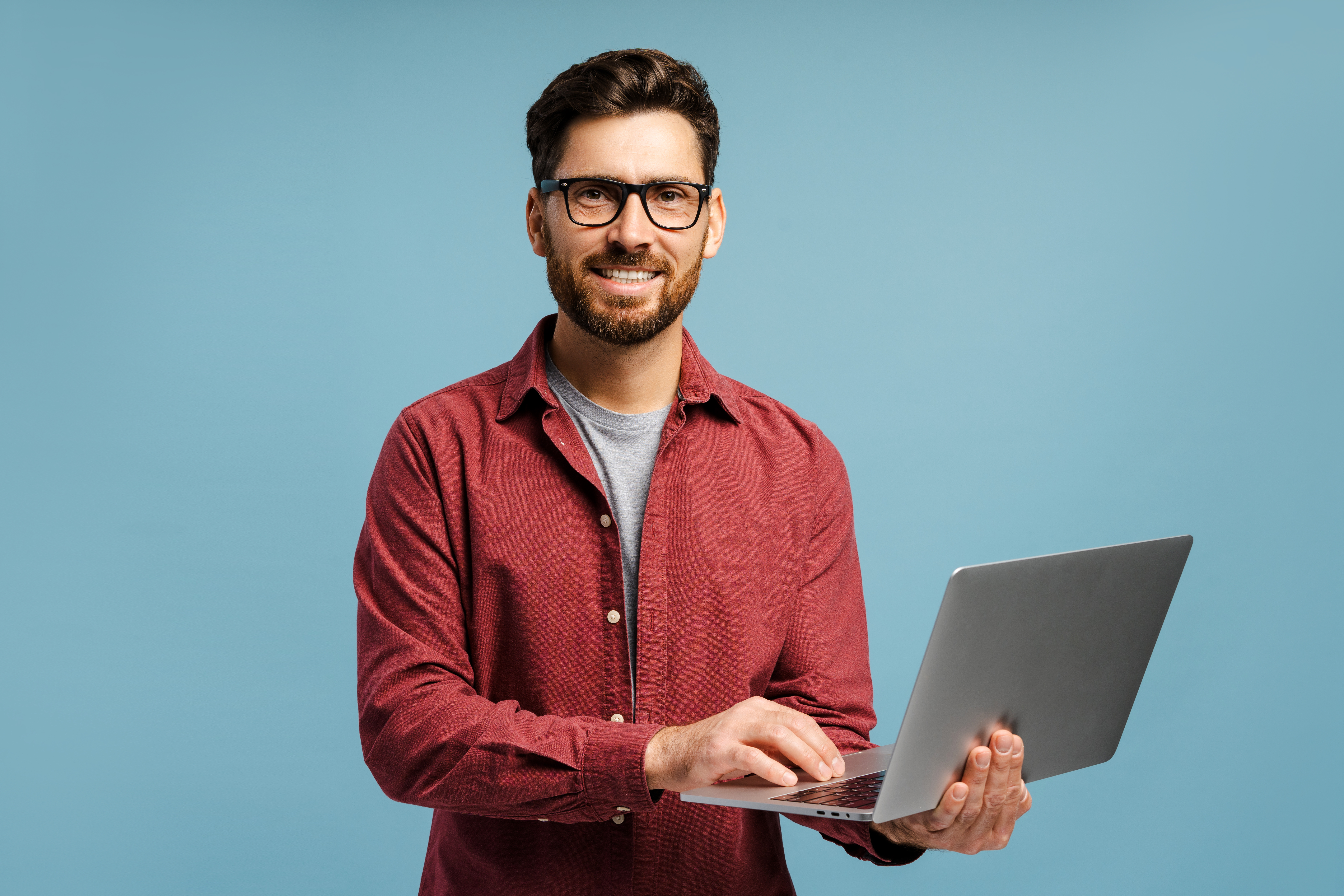 smiling happy man wearing eyeglasses holding lap 5e33d92faa8ab0c2ddfc
