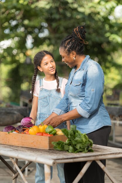 Smiling Mom And Daughter With A Tray Of Fruit And 6F8513B17E1B23A7A533