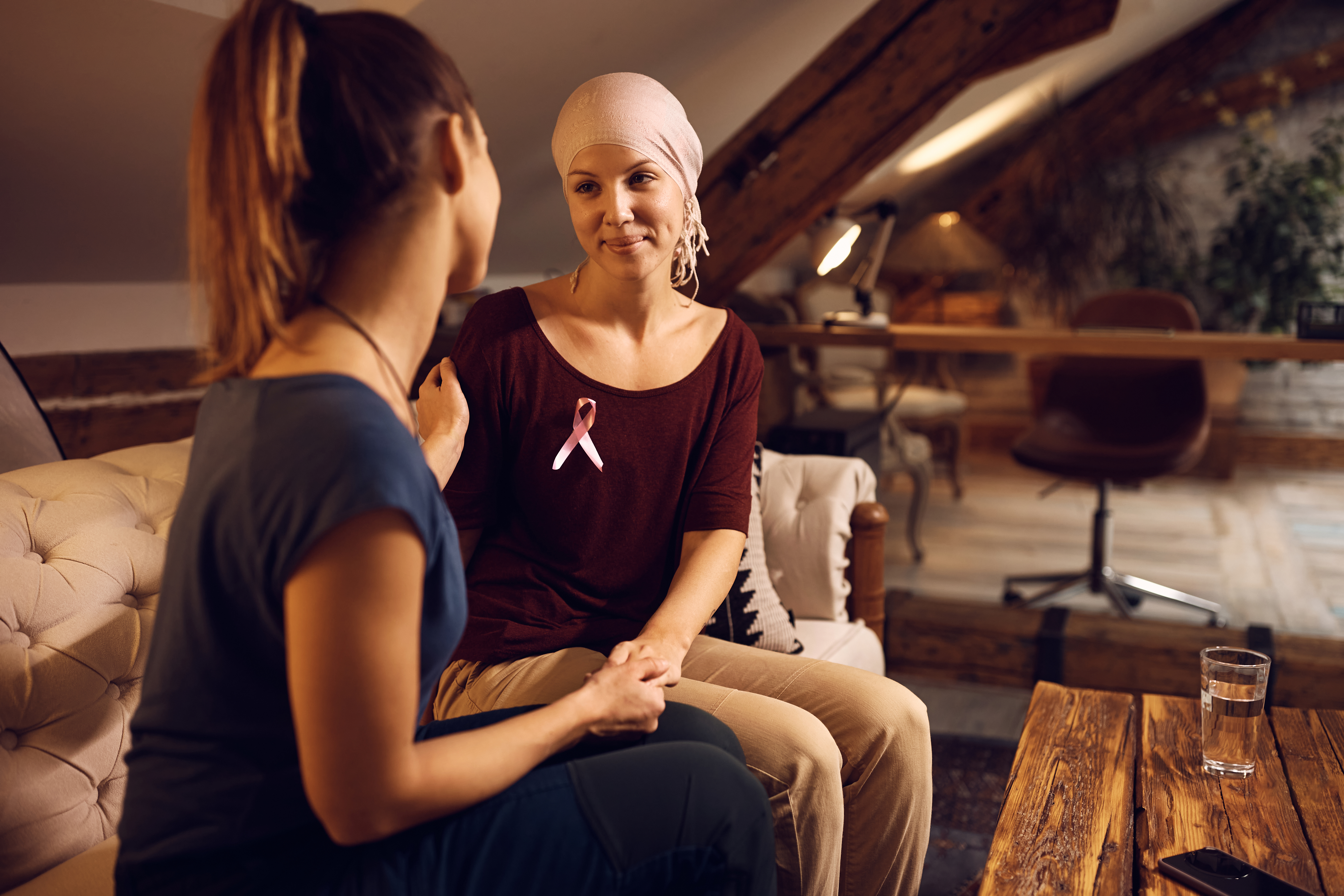 Featured image: Smiling woman with breast cancer talking to her fe-5c7aedced5f17f75bedf