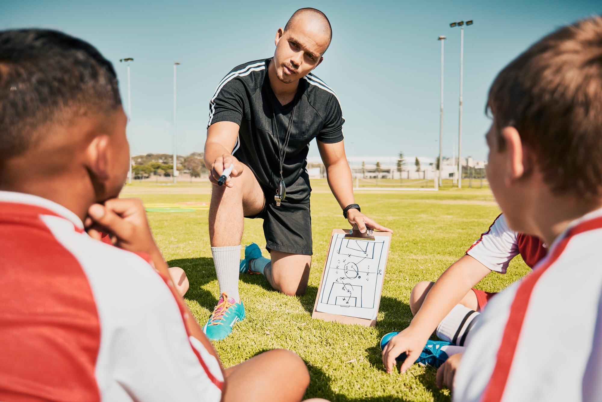 Soccer Team Children And Coach With Clipboard Whil C2d72129d46bf9d3f821