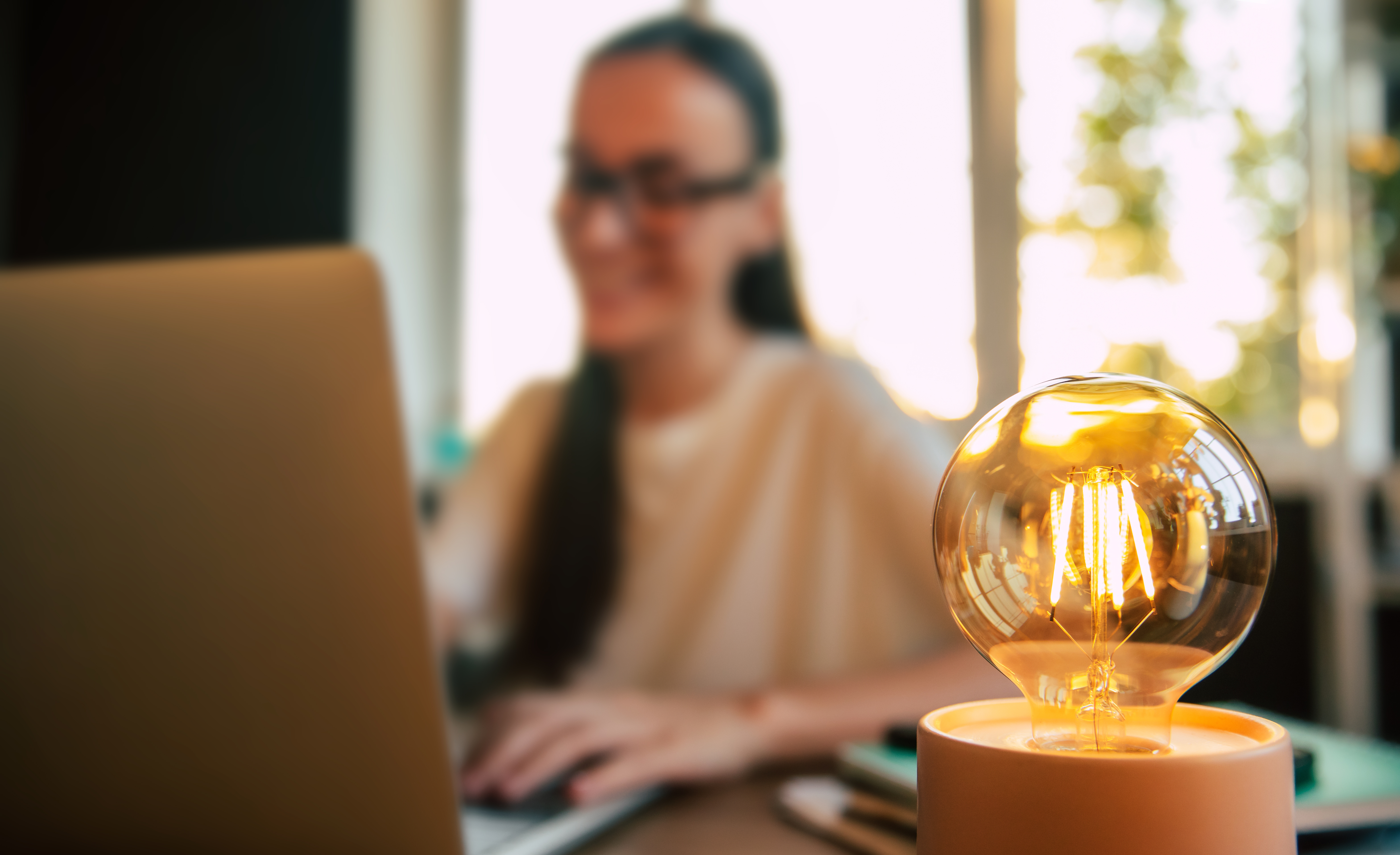 soft focus shot of woman working on a laptop at a bf66fd32133200eed199
