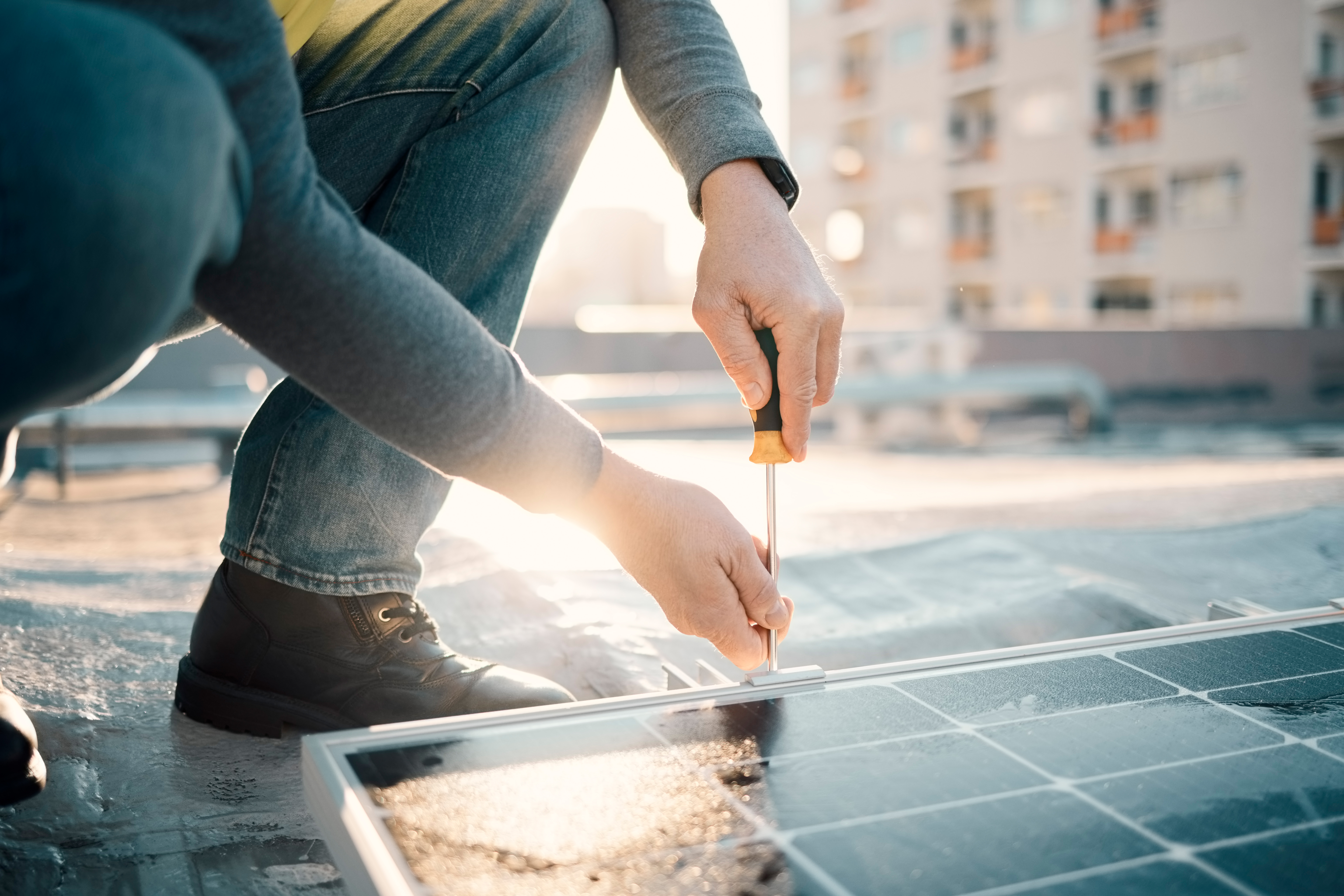 Navigating the Solar Installation Journey with Ease: Your Guide to a Brighter Future 1 solar panel screwdriver and worker hands with too 2bcb08138e6104428934