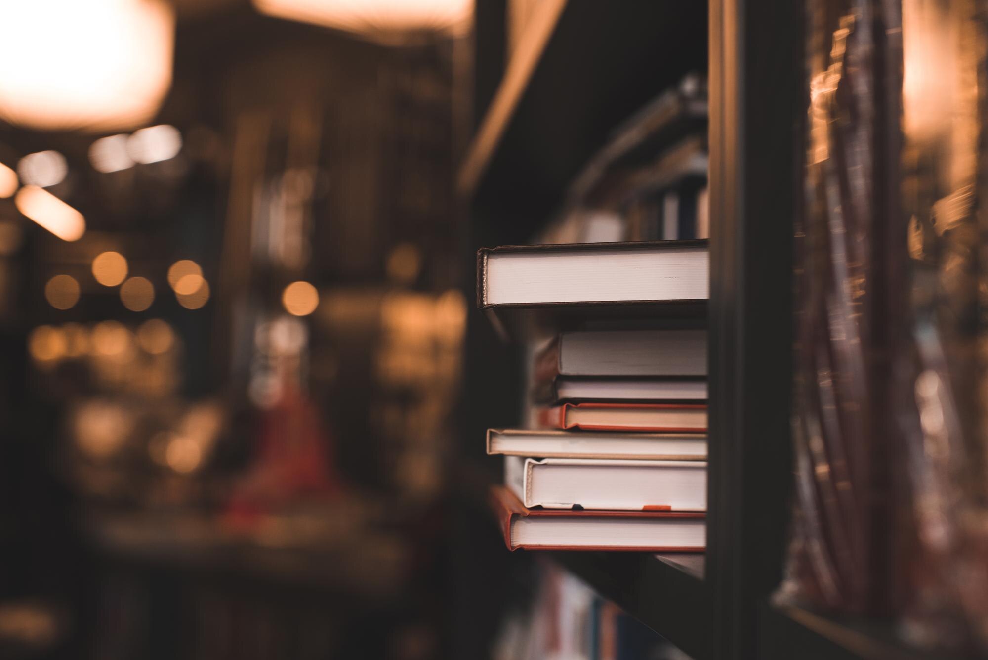 stack of paper books in bookstore or library close 2a72fd784527dc259ceb