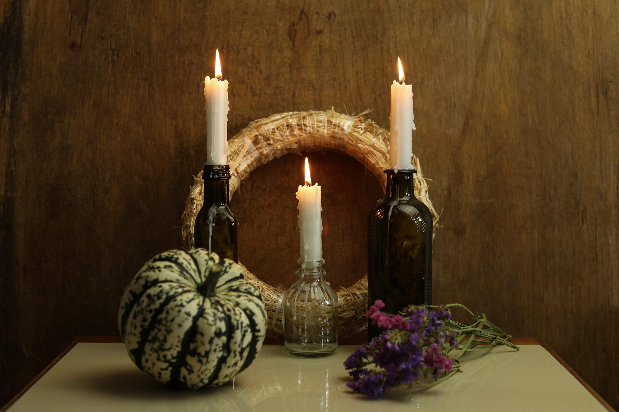 still life with burning candles pumpkin a wreath a e06b4568a455fe3da923
