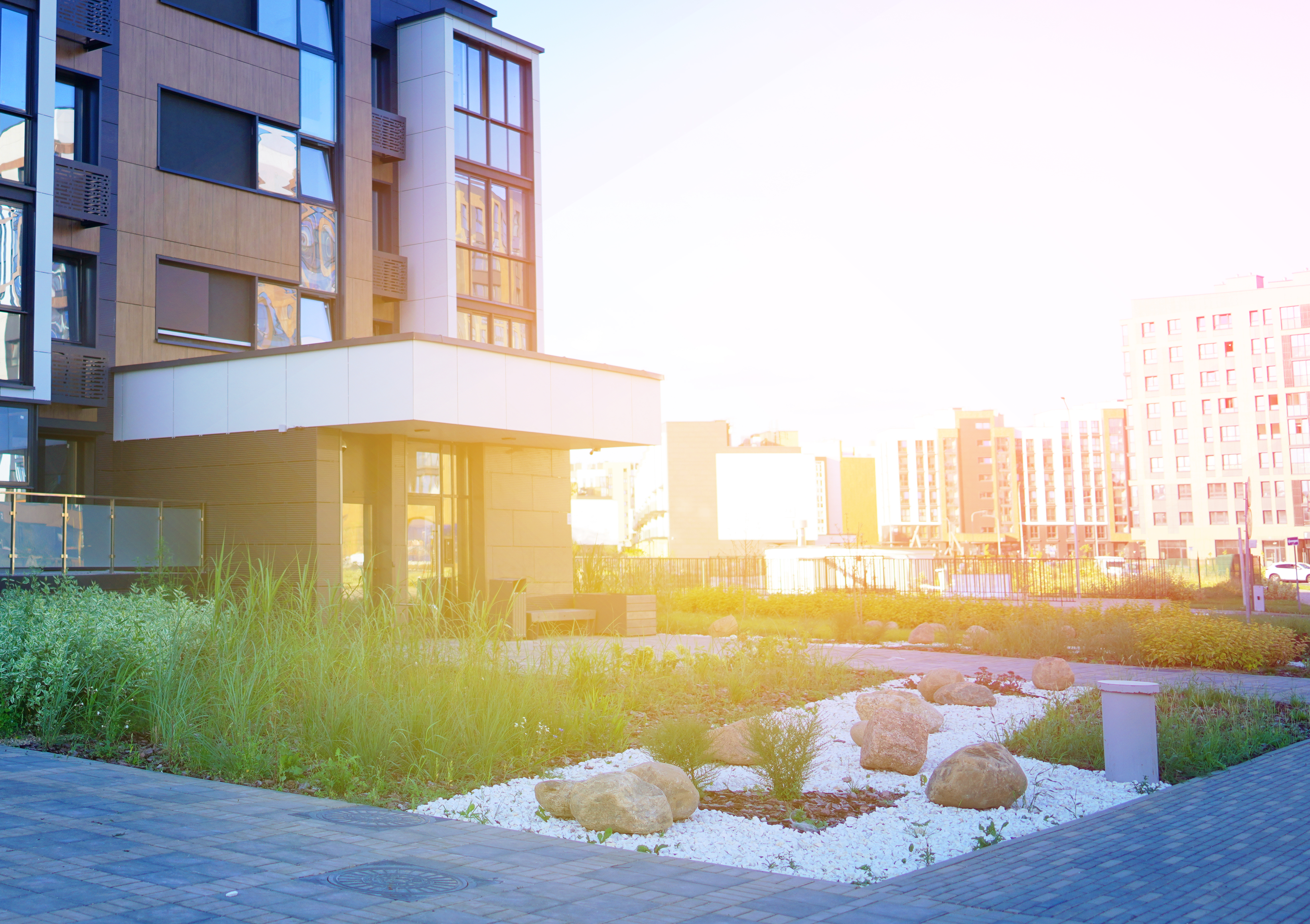 Featured image: Stone on lawn at entrance of apartment residential-70738366bb4557c0ee9e