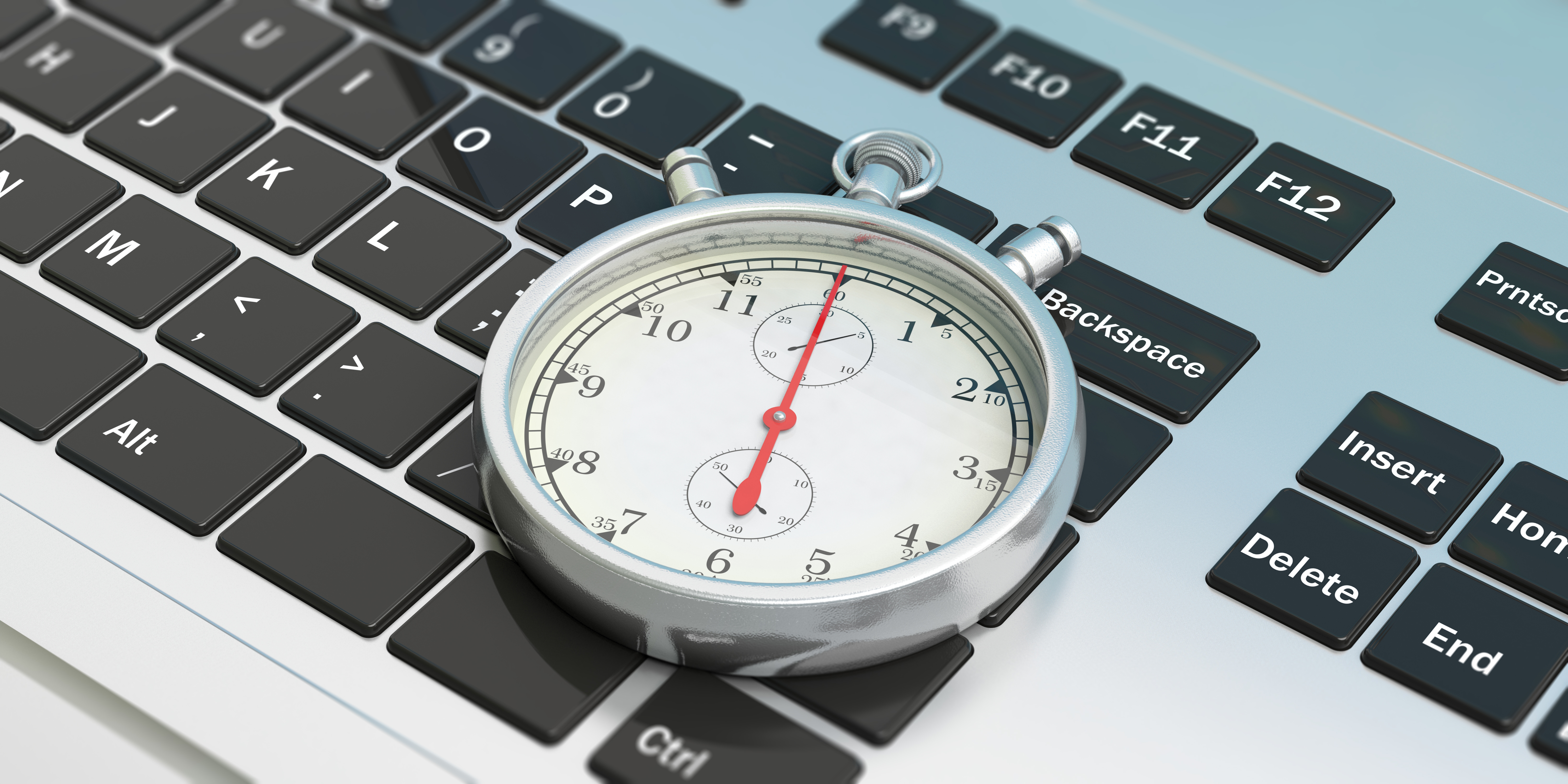 A stopwatch on a laptop keyboard, symbolizing the importance of website speed.