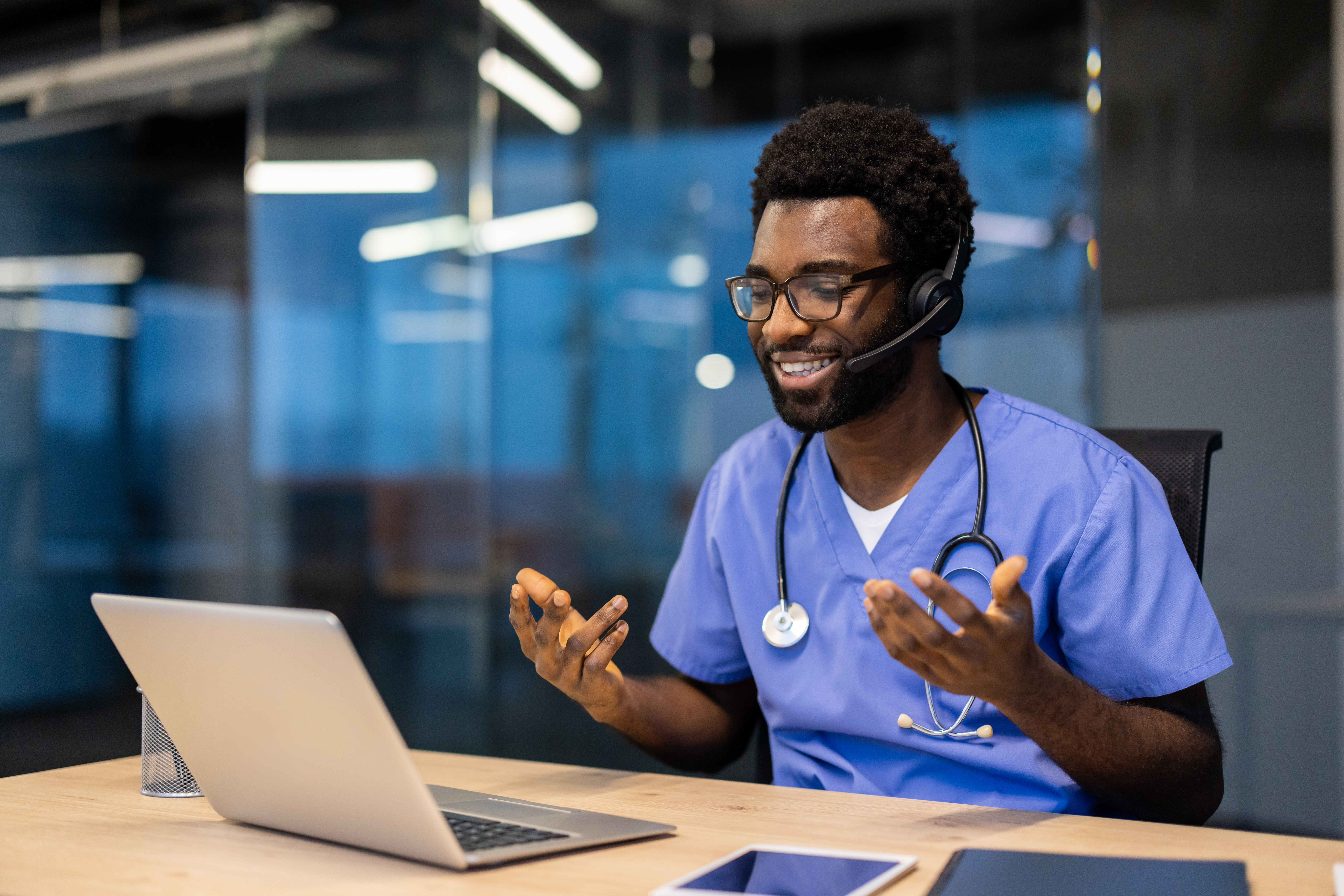 successful experienced doctor with headset and lap 1ec4182fb9714031d966