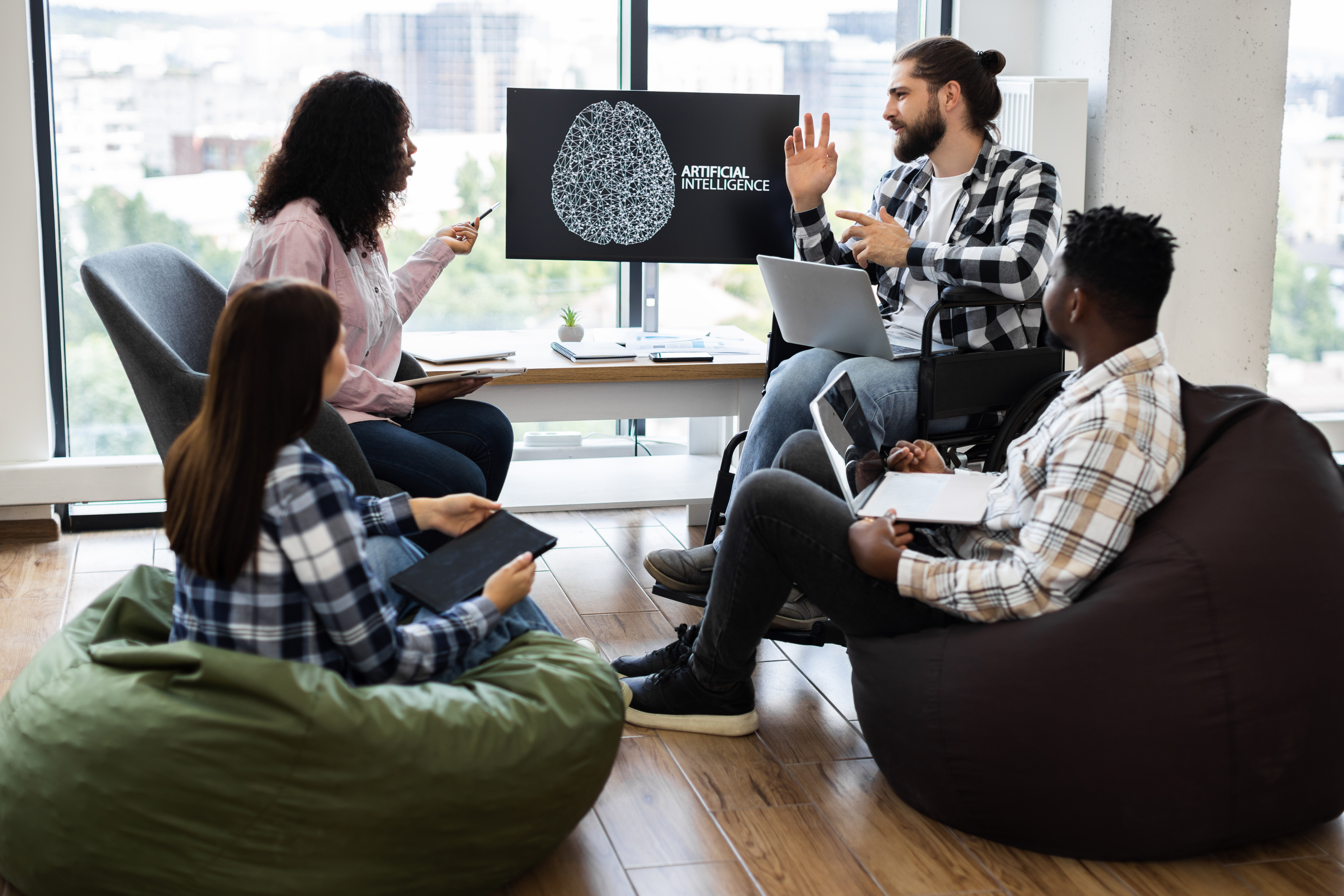 Team collaborating on artificial intelligence project, discussing local SEO strategies, with a presentation on artificial intelligence displayed on screen.