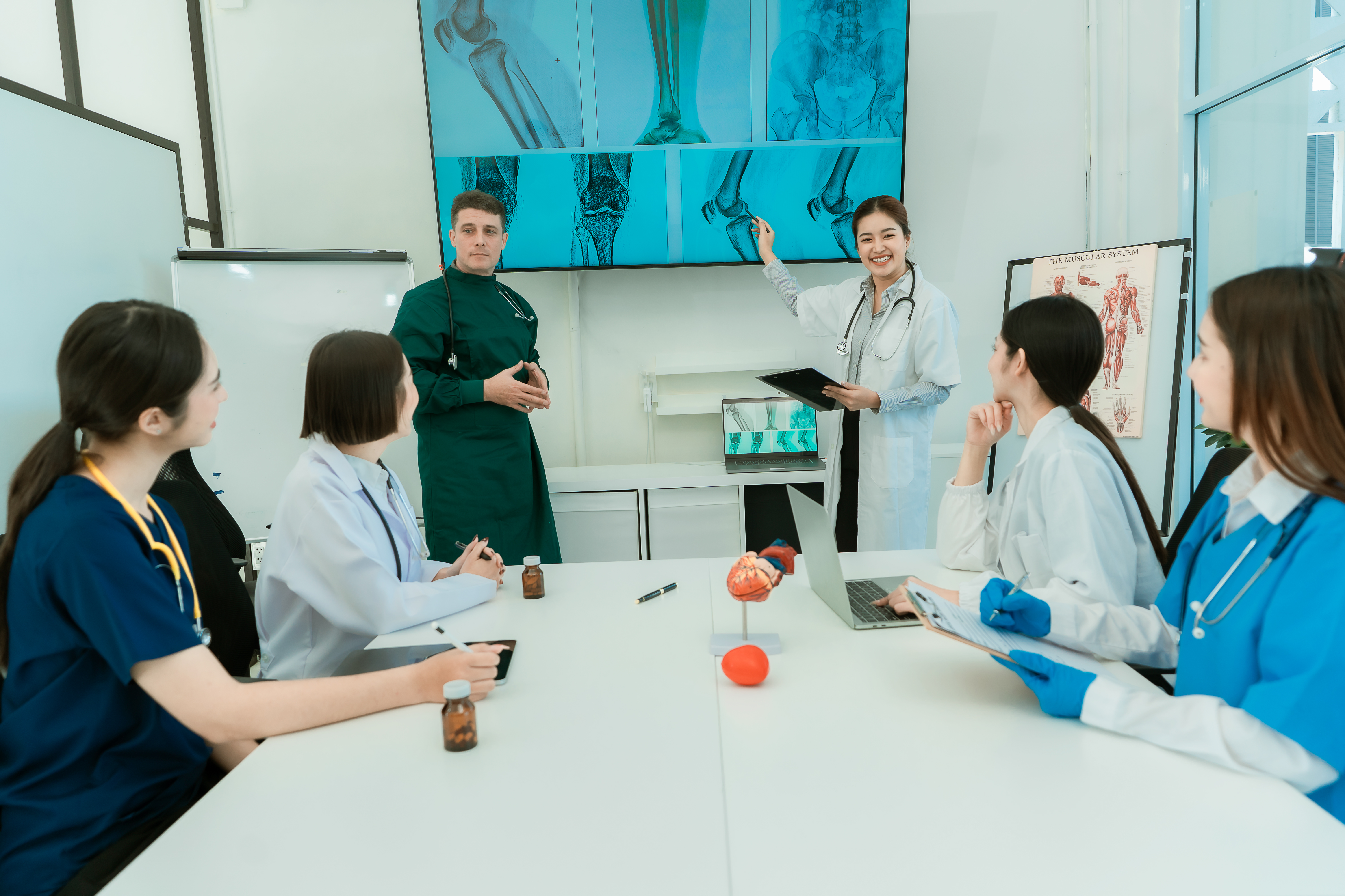 team of doctors working on digital tablet doctors 357aac4268edf35cadc7