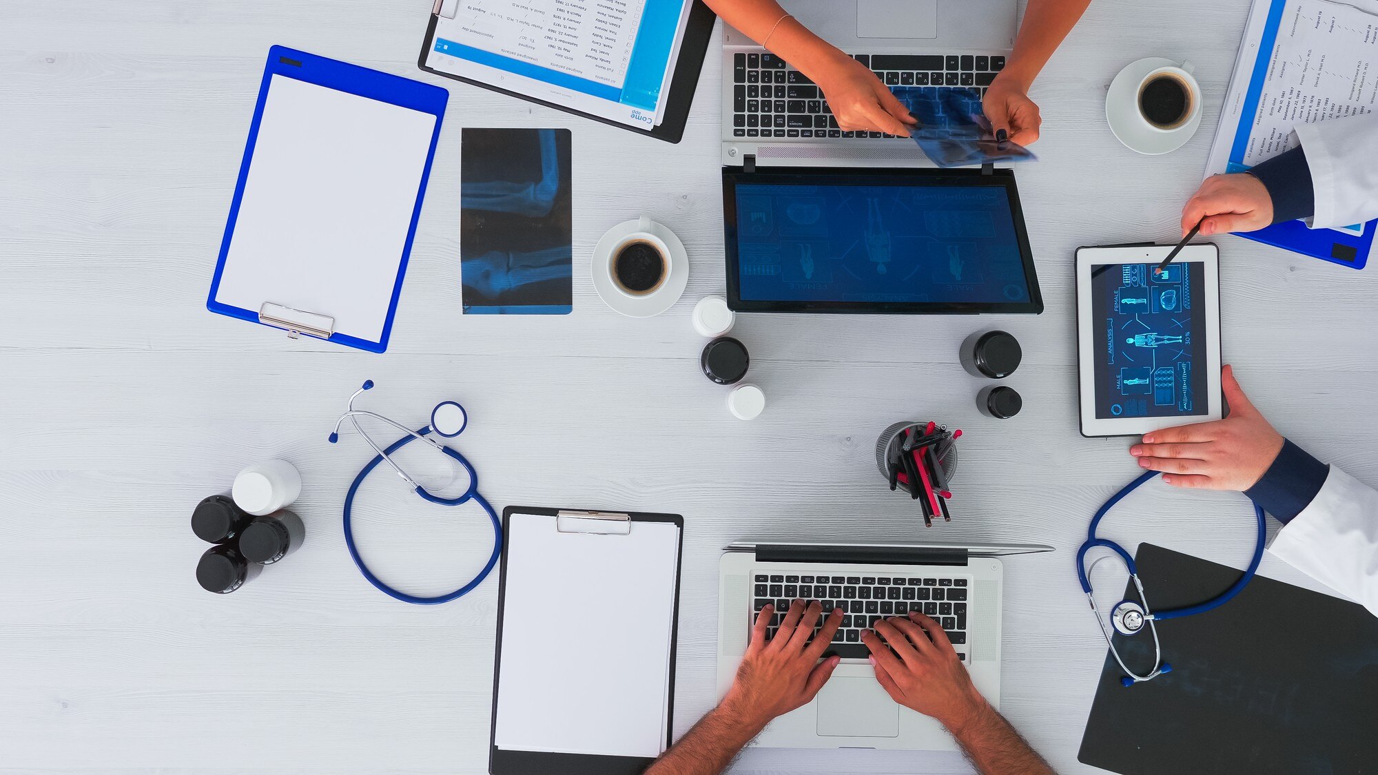 The Intersection of Technology and Branding in Healthcare Marketing: A Path to Growth 1 - MedWell Digital Marketing Agency team of physicians discussing diagnosis for patien 71d8c20a8a5d1fa5bb24 - MedWell Digital Marketing Agency