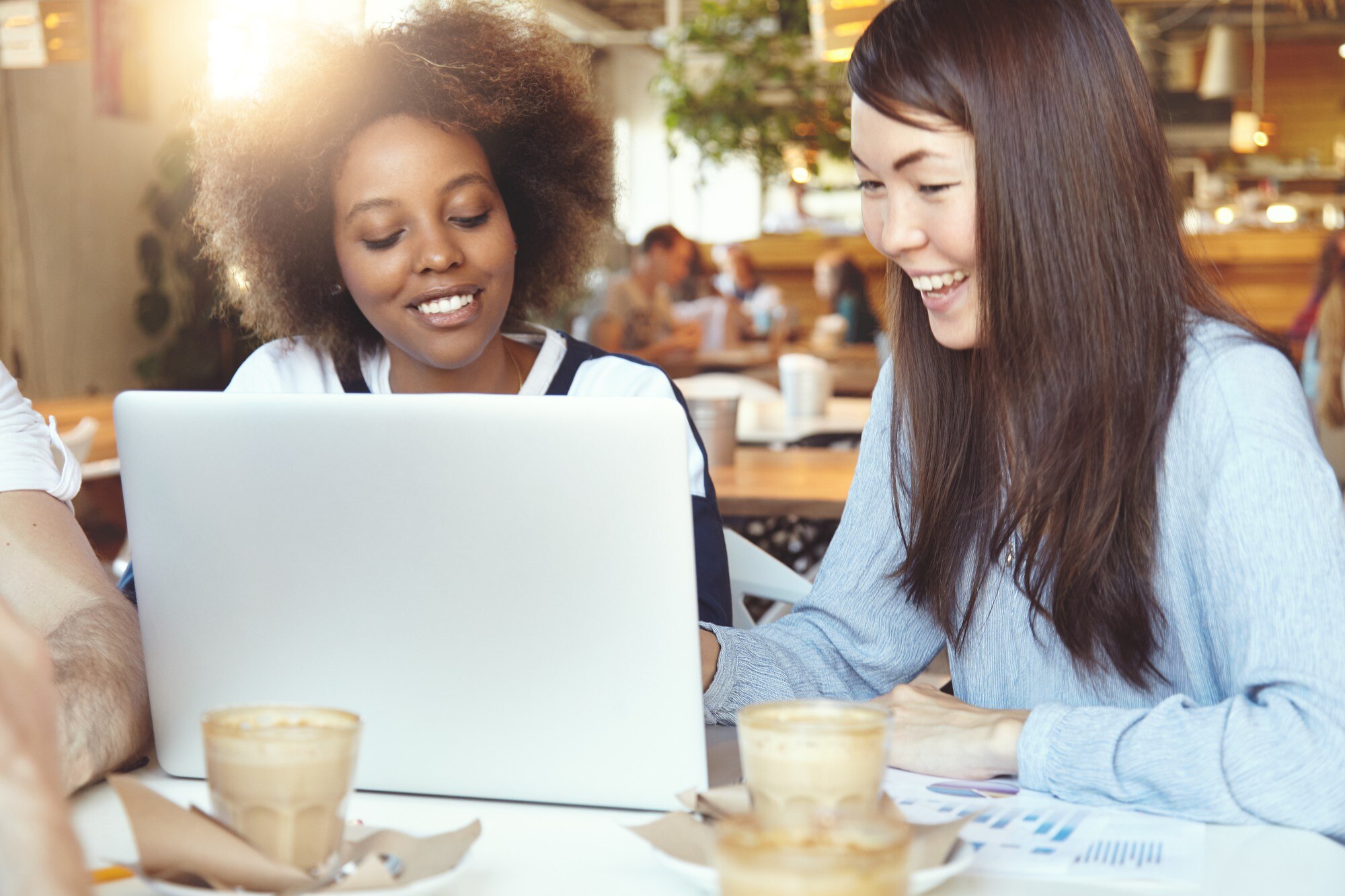 Join the Travel Tribe: Unlock Business Growth and Support 1 team of young colleagues having meeting at cafe 7627d067e87a6b419619
