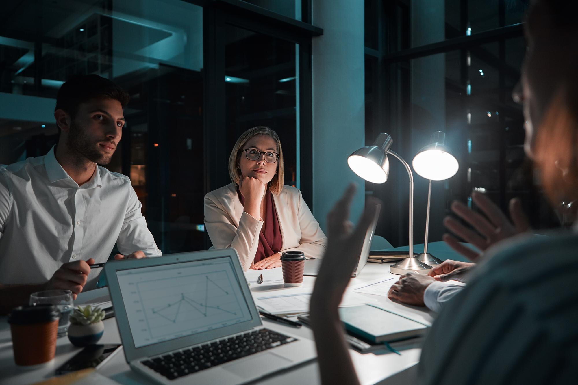 teamwork people and laptop in office at night with 5ef114327c442b1e14e1