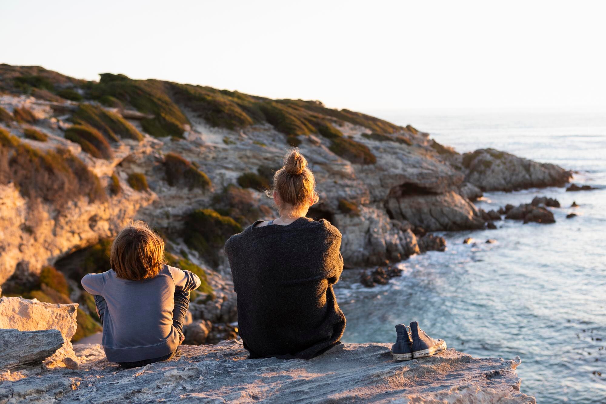 teenage girl and young boy sitting on rocks lookin 30fda190c6bfd91bb4f8 BTOURS