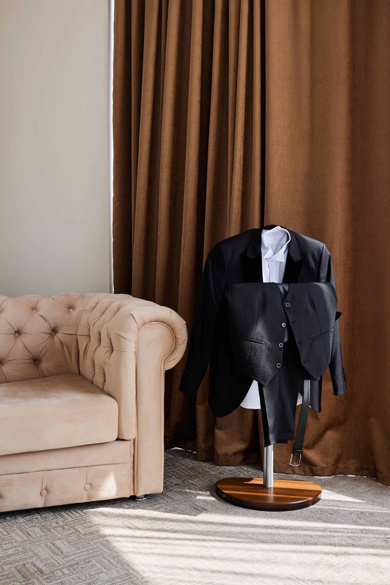 Crafting the Perfect Wedding Suit: Tailored Just for You in Bangkok The Groom39s Wedding Suit On A Hanger A Room With 5399373658bedaf4e2d1