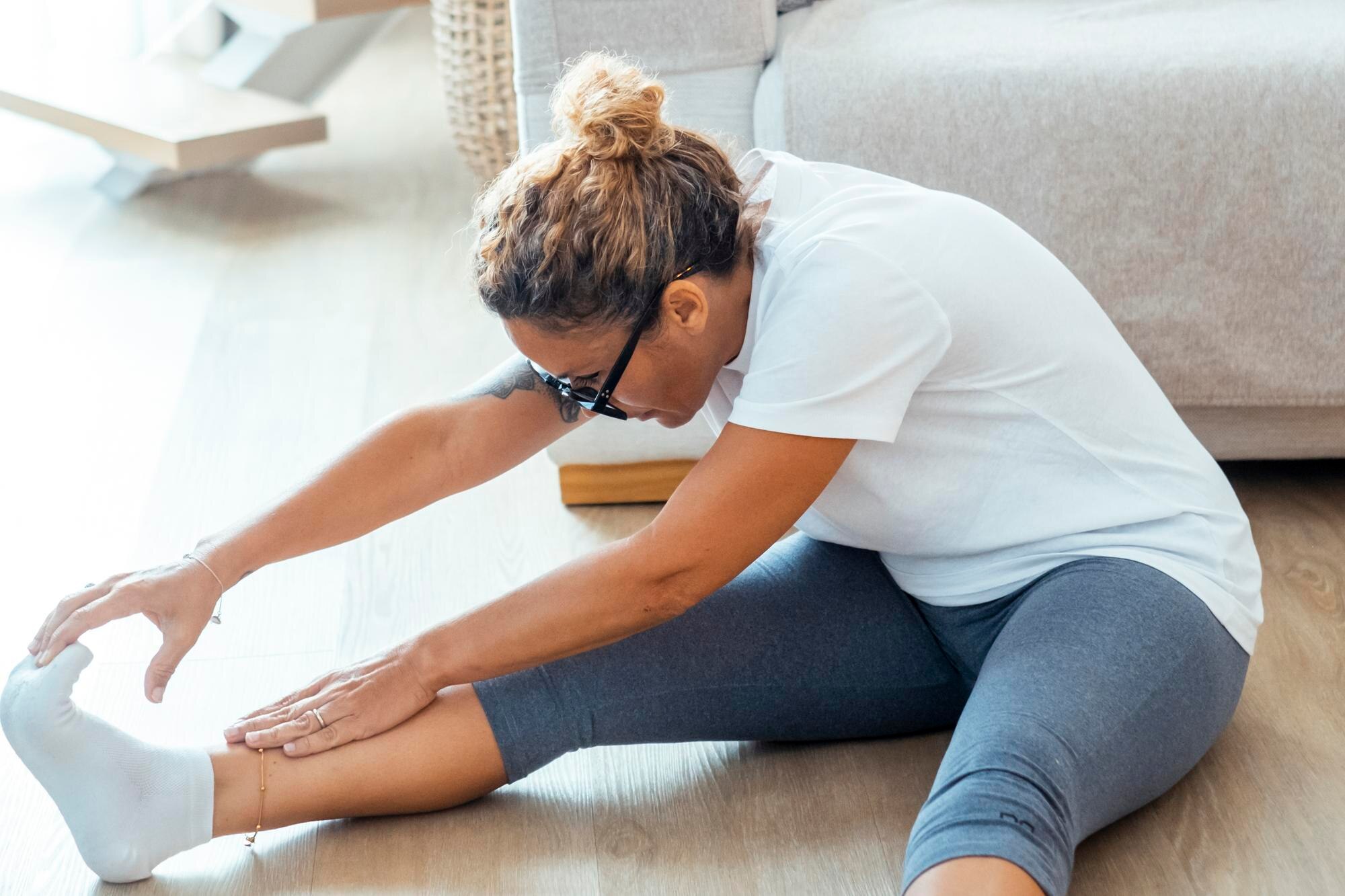 Top 5 Conditions Treated with High‑Intensity Laser in Port Credit 1 the woman practices yoga or pilates in her apartme f138bb0924afa48389f0