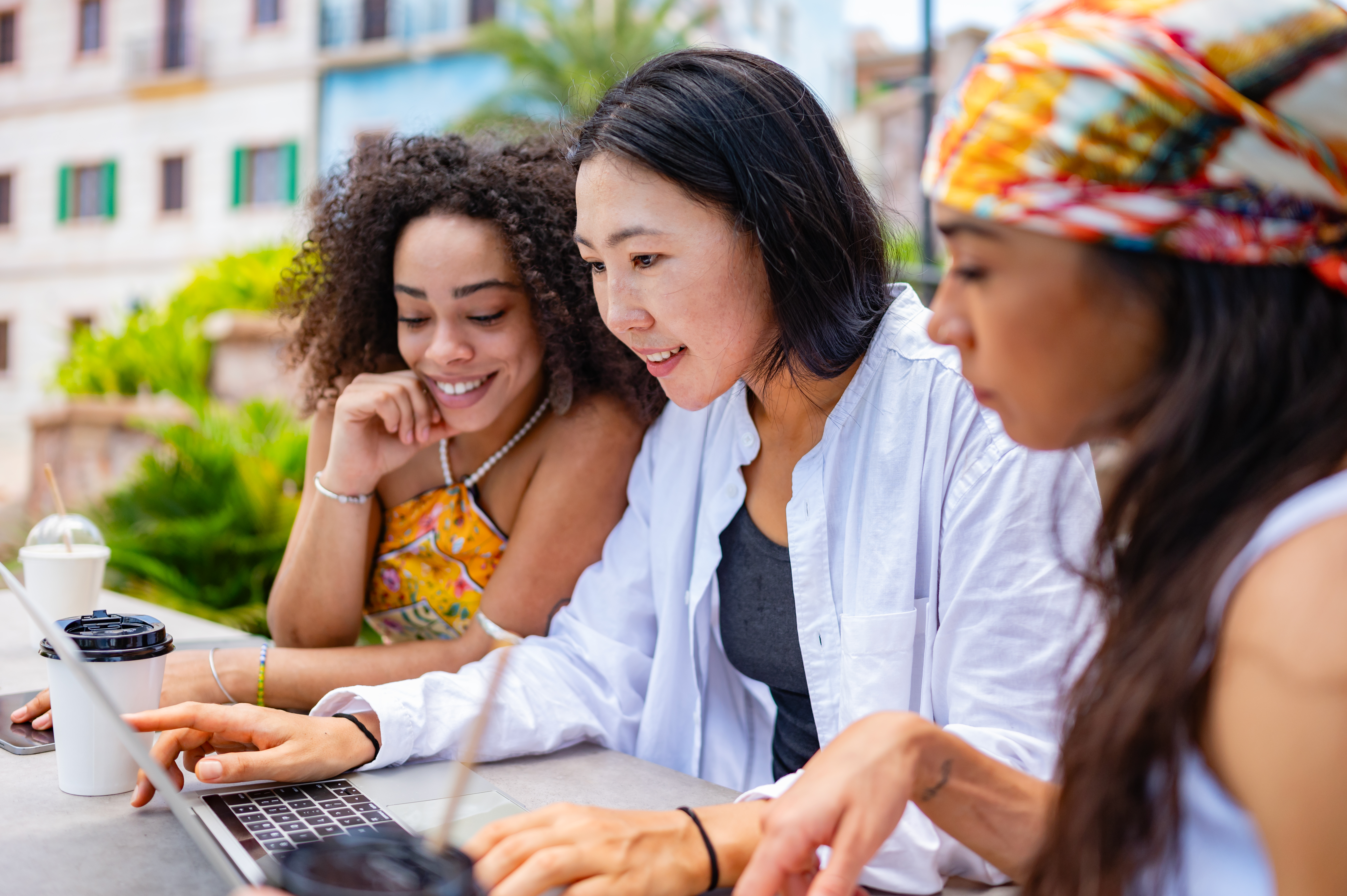 Unlock the World: Work-from-Anywhere Tips for Aspiring Travel Business Owners 3 three diverse young women one black one asian a 8306471f70825fd51400