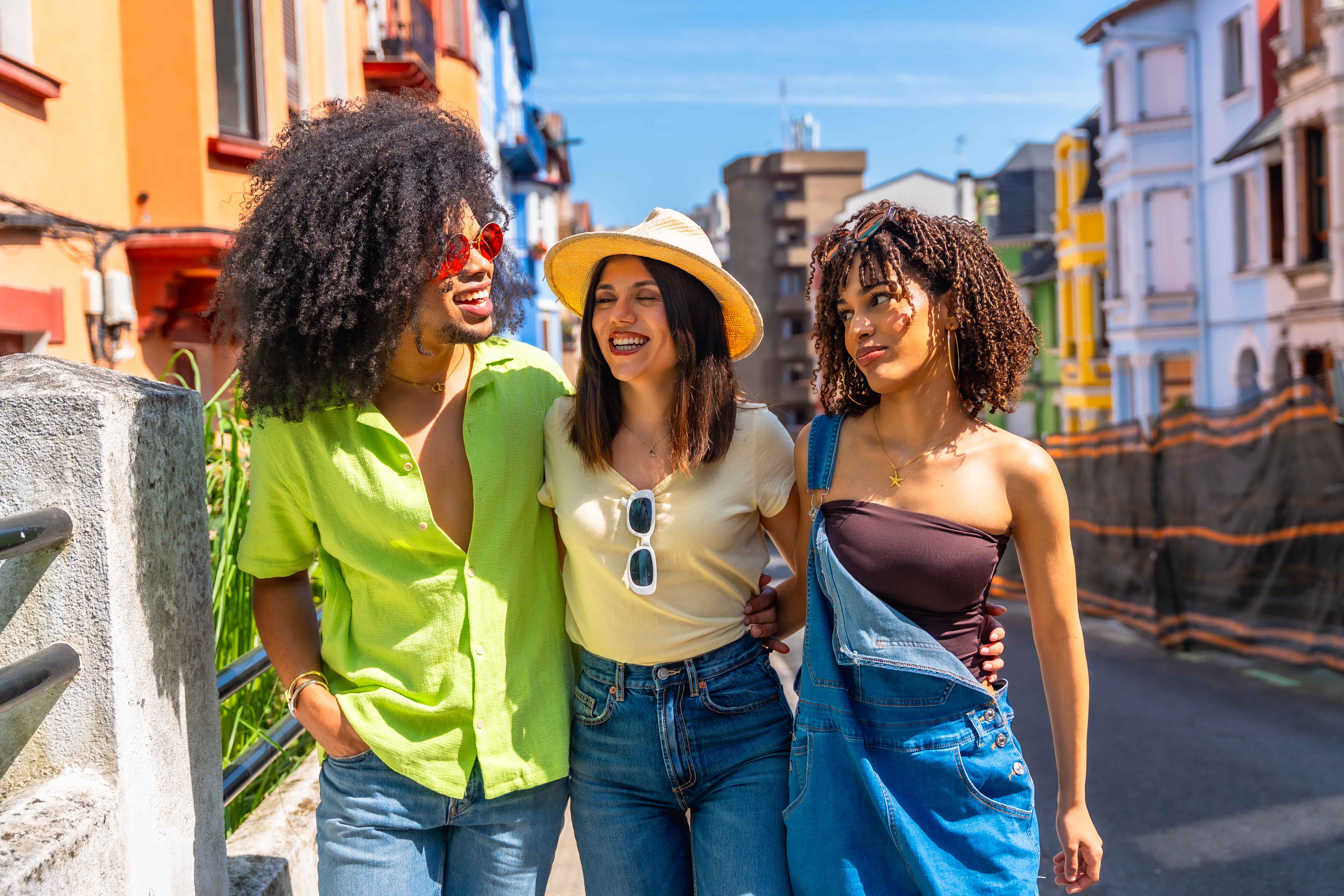Empowering Women Through Travel: Build Your Legacy of Freedom and Adventure 1 three young adults walking down a colorful street 1e3efd2d17798e17640c