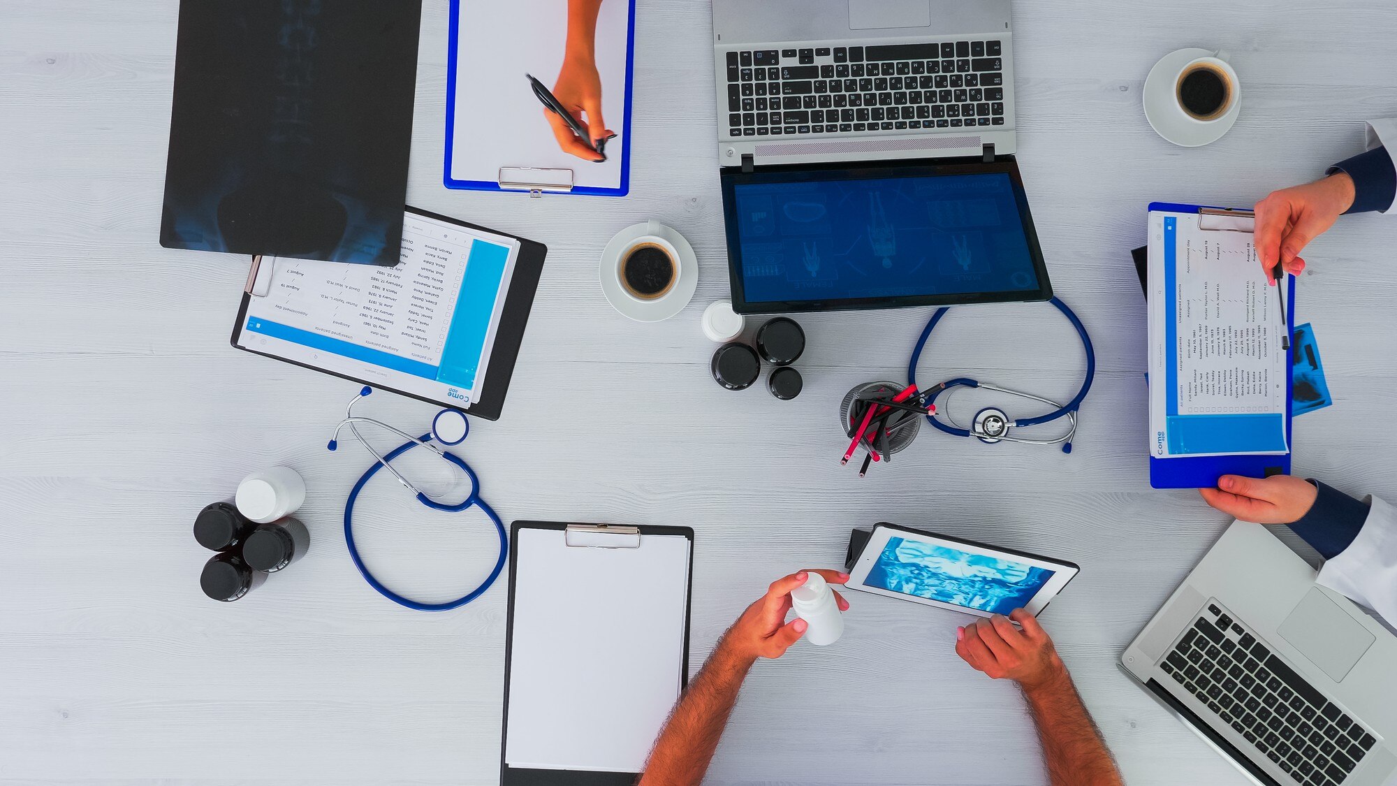 top view of team doctors on desk table with stetho 9f8fdd18e470ce6661b7 - MedWell Digital Marketing Agency