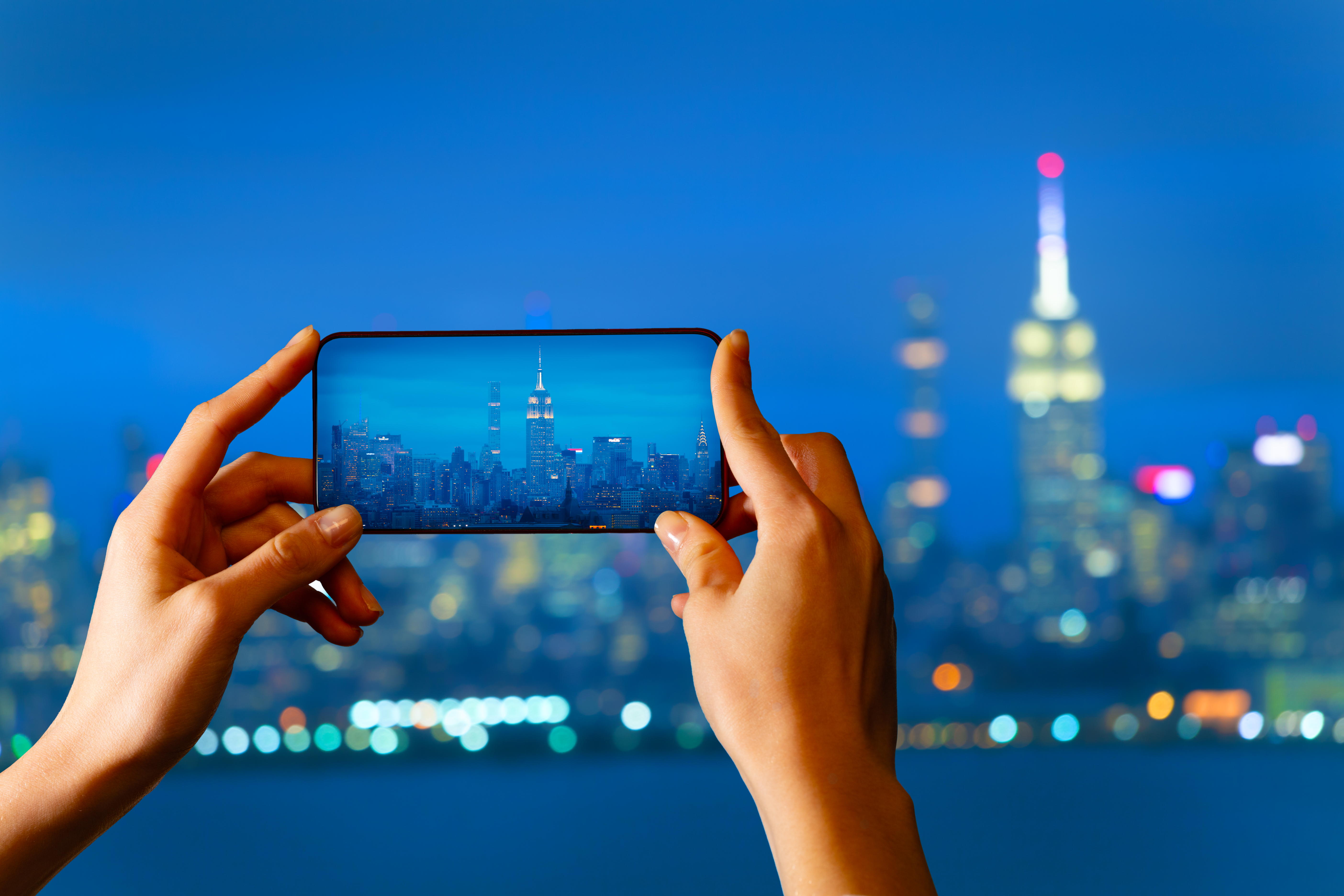 tourist take picture of new york panorama at night 64c62d73ca39e2ca0108 Choosing the Right Booking Platform: What Makes RSViP Stand Out?