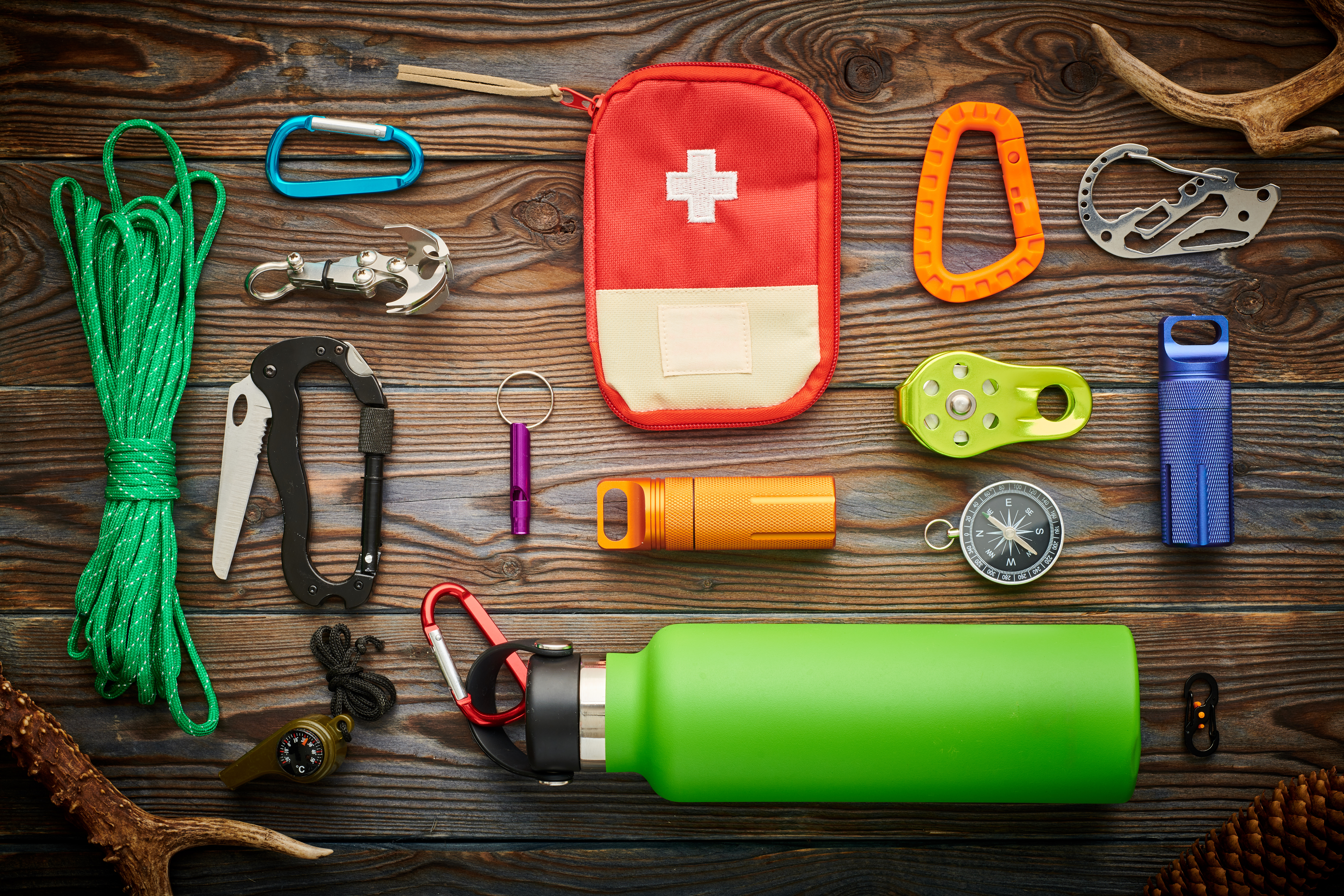 travel items for hiking over wooden background 96323c40e58829dbf1d6